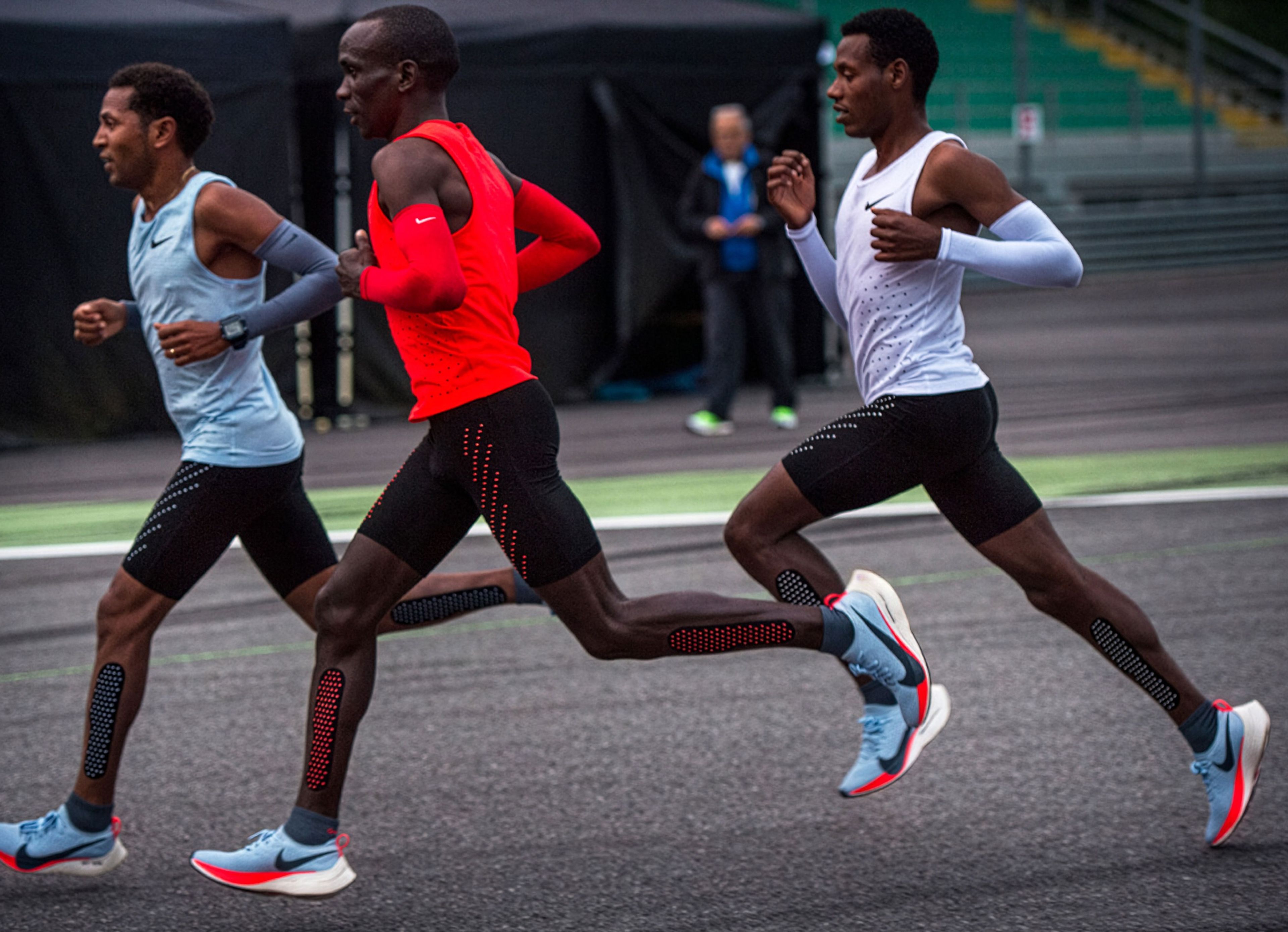 Eliud Kipchoge, Lelisa Desisa, and Zersenay Tadese running together for Breaking4 in custom Nike Zoom Air Vaporfly Elite shoes.