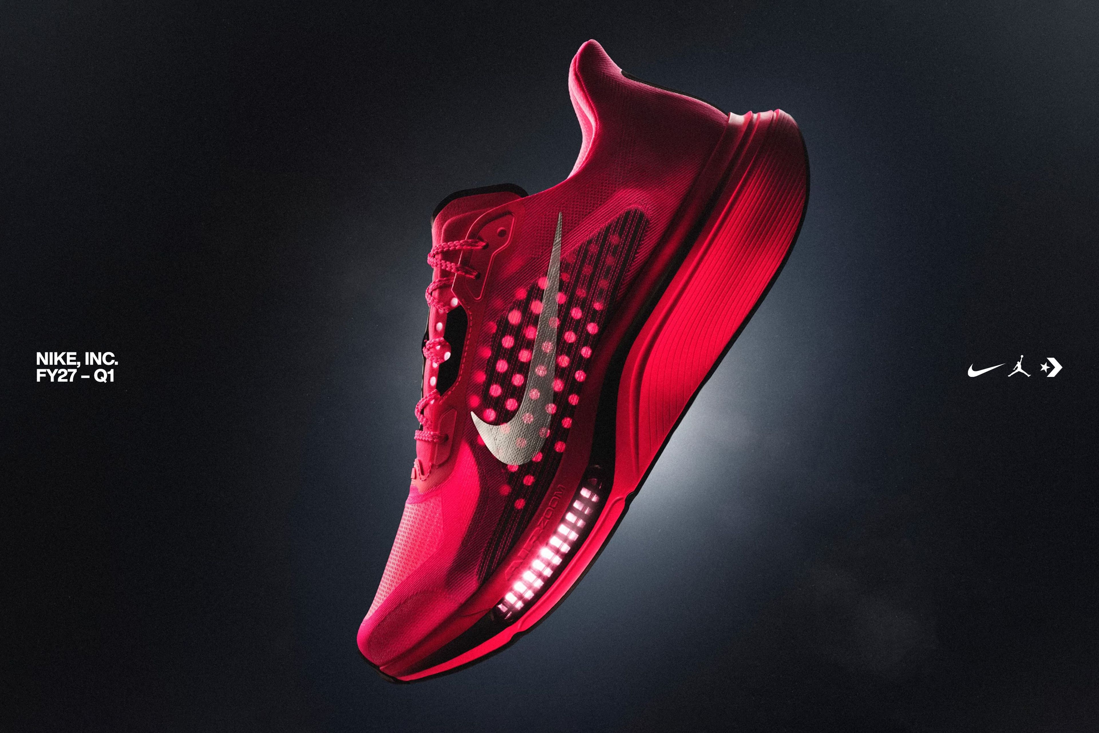 Red Nike Pegasus Plus 2 running shoe with Swoosh logo floating on dark background. NIKE, Inc. FY27 Q1 text, Nike, Jordan Brand and Converse logos visible.