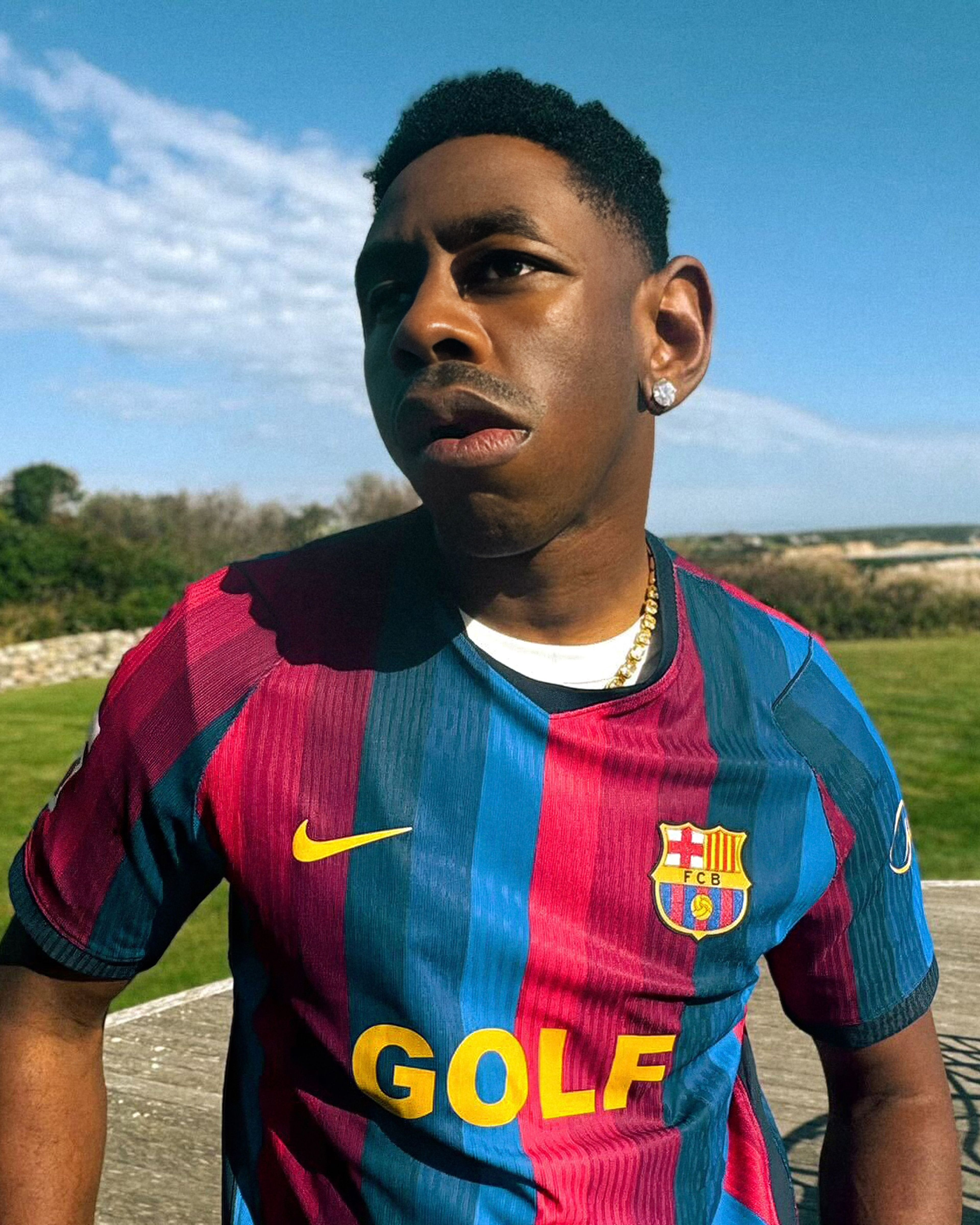 Person wearing Nike x FC Barcelona x GOLF WANG (GOLF) jersey.