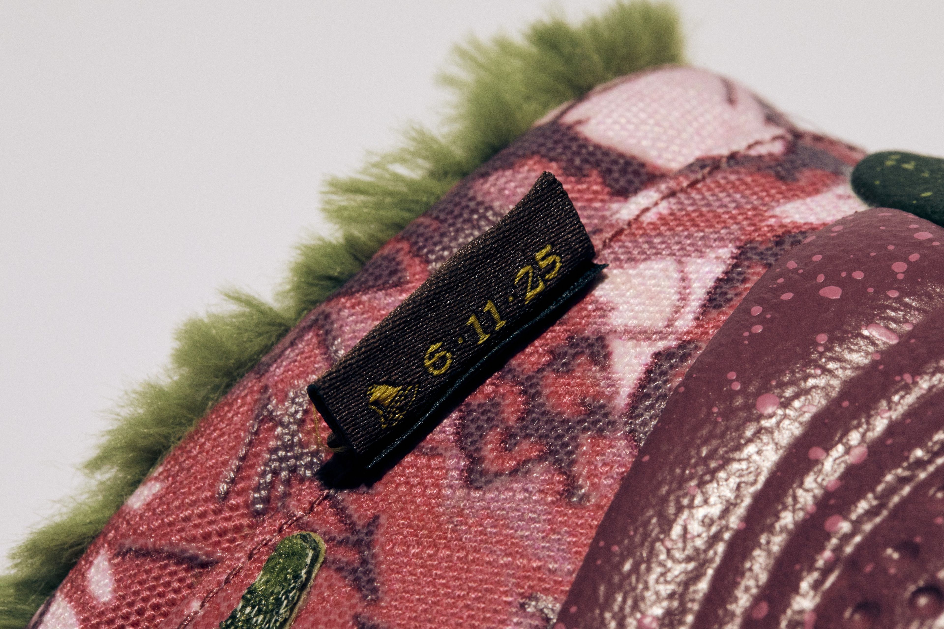 Close-up of a limited-edition Nike ACG Rufus sneaker upper with a black woven tag.