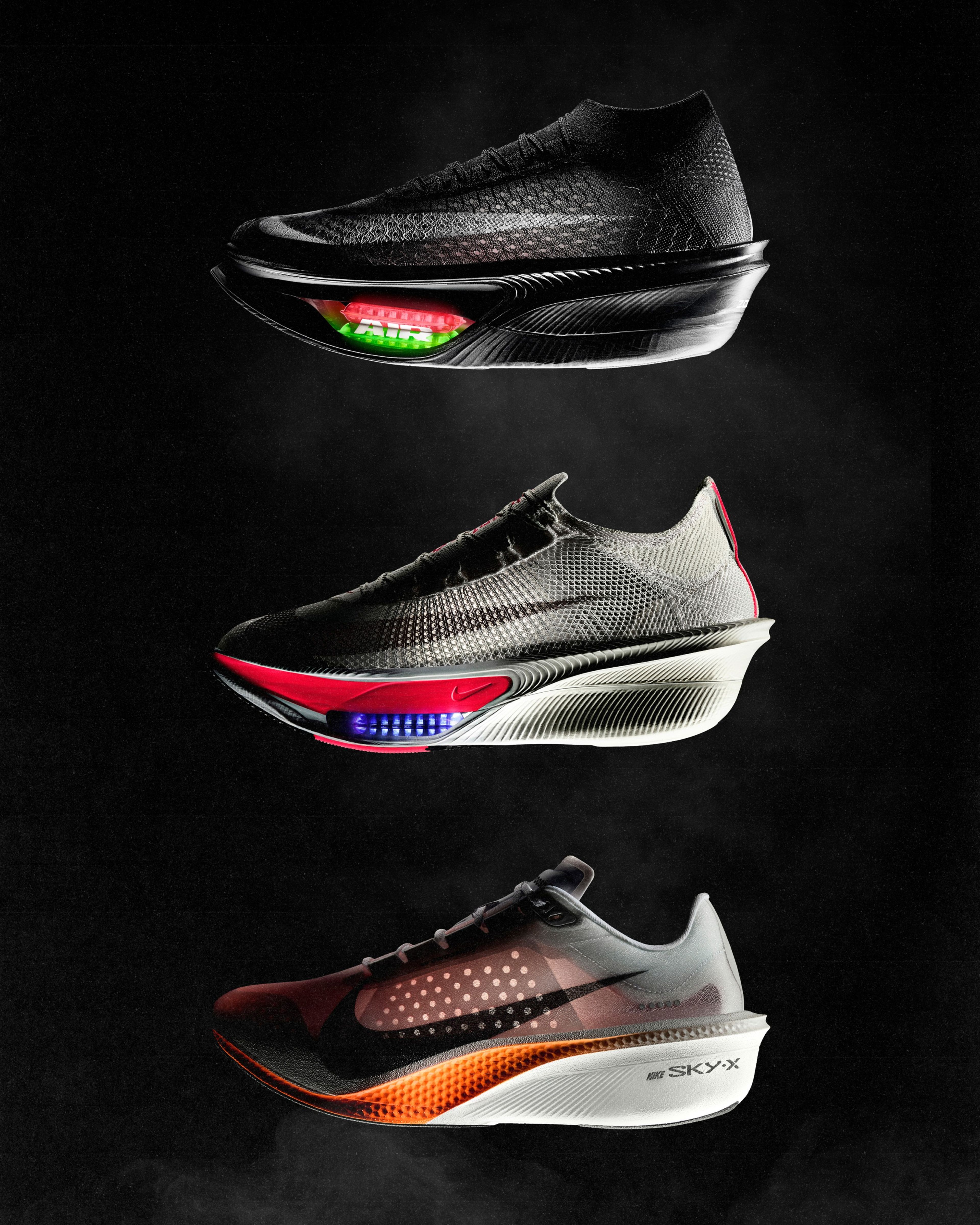 Three Nike running shoes on dark background: a black Apex with glowing Air Zoom, gray Alphafly 4 with red and blue midsole accents, and Swooshfly with an orange midsole