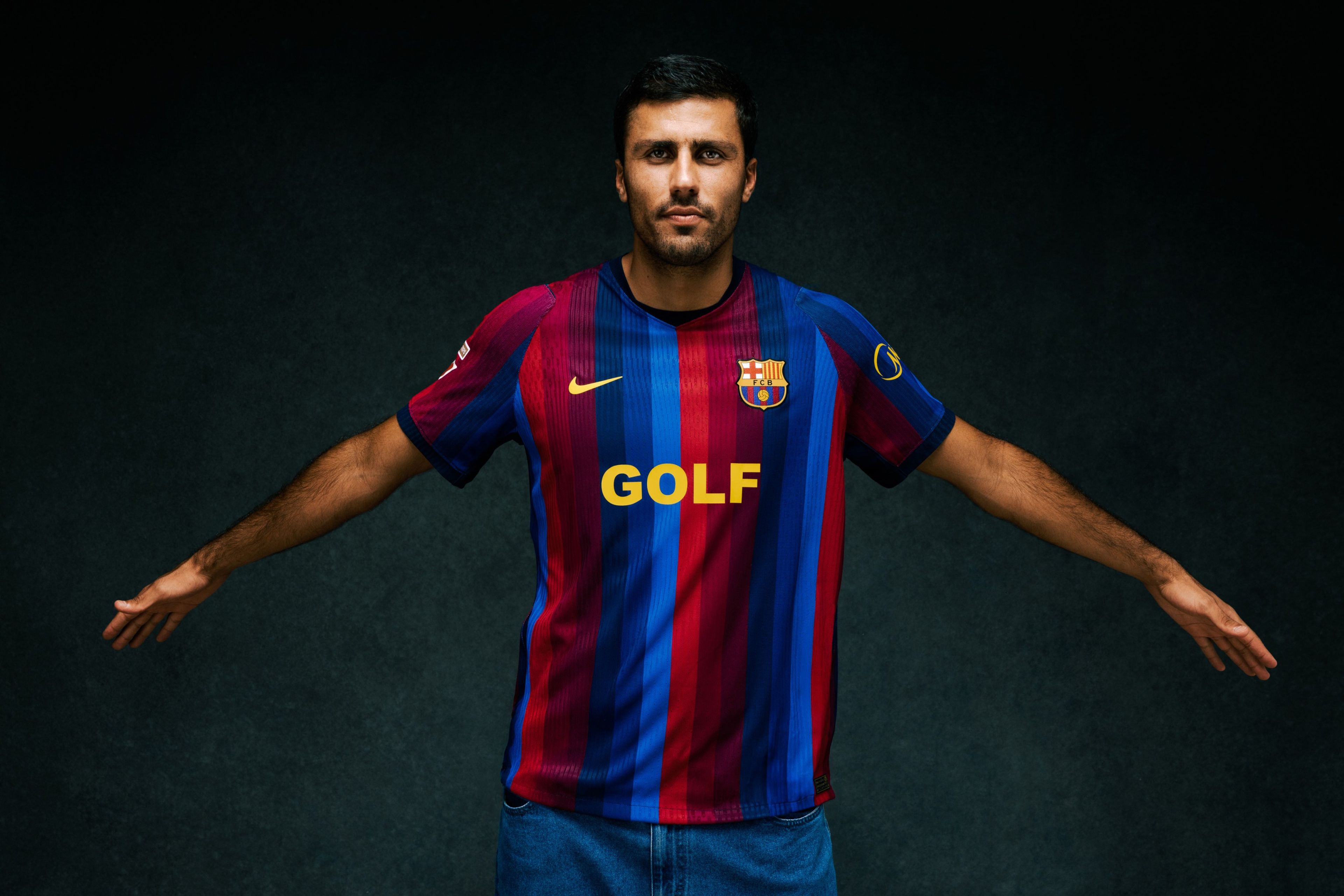 Person wearing clothing from the Nike x FC Barcelona x GOLF WANG (GOLF) collection.
