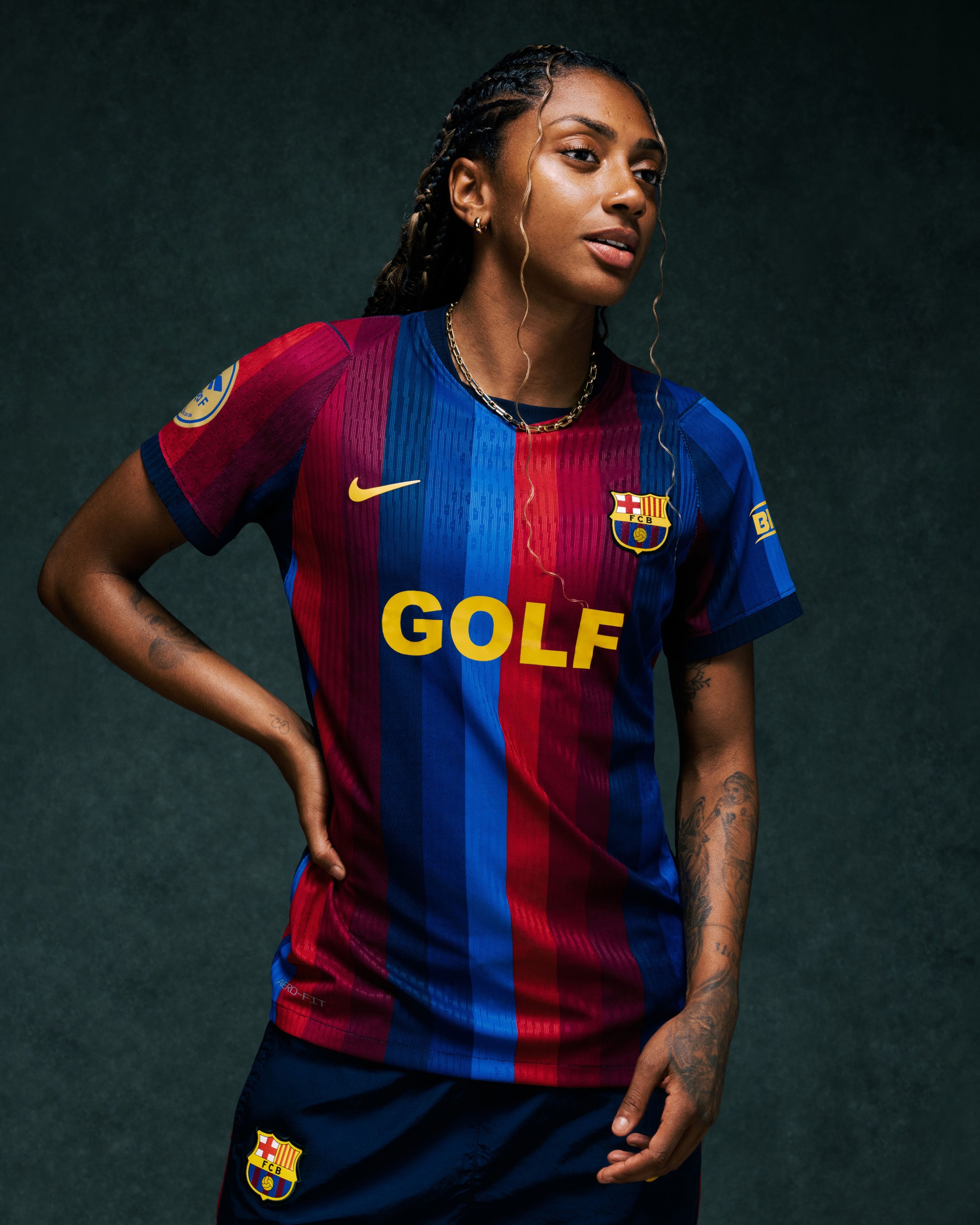 Person wearing Nike x FC Barcelona x GOLF WANG (GOLF) jersey.