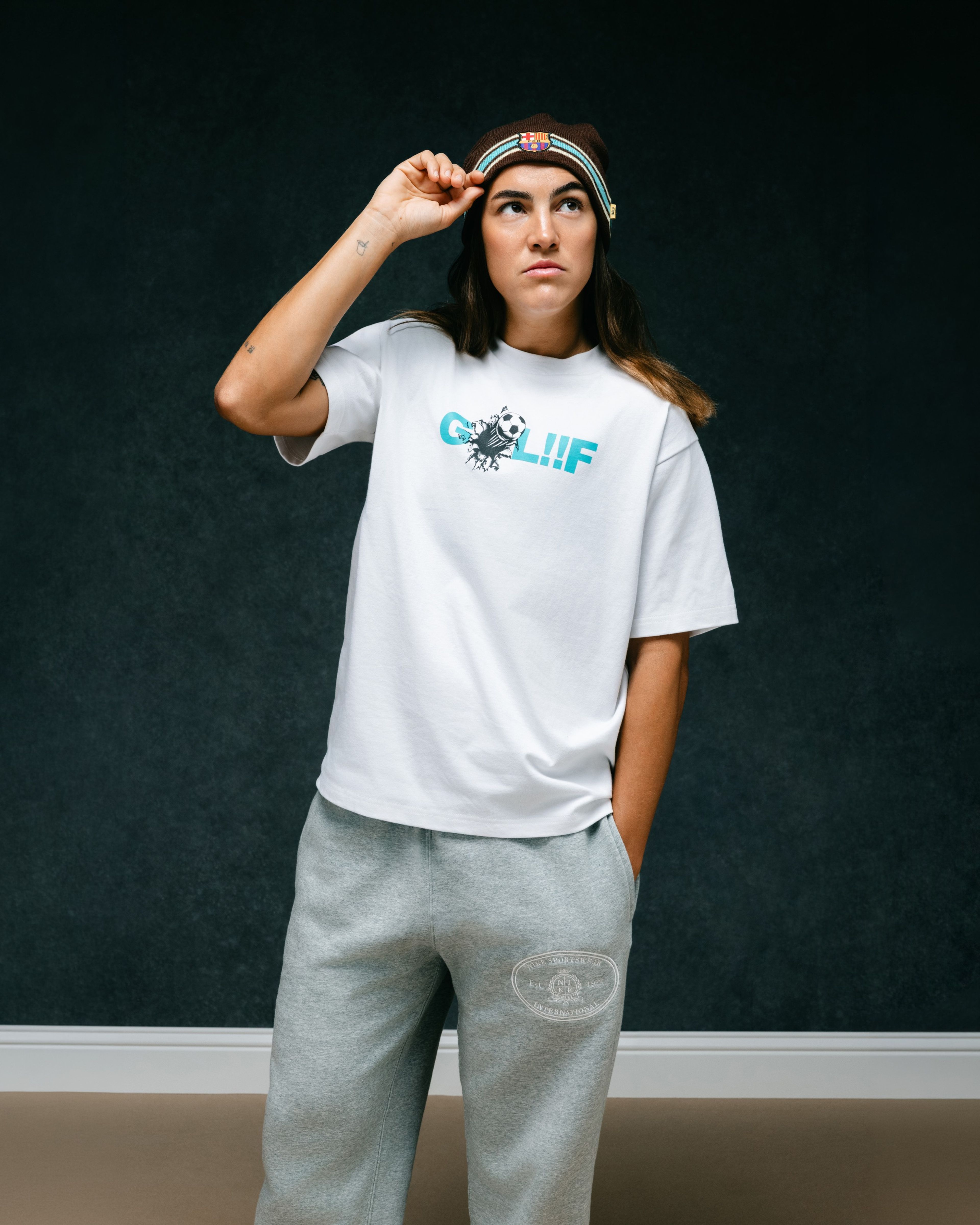 Person wearing clothing from the Nike x FC Barcelona x GOLF WANG (GOLF) collection.