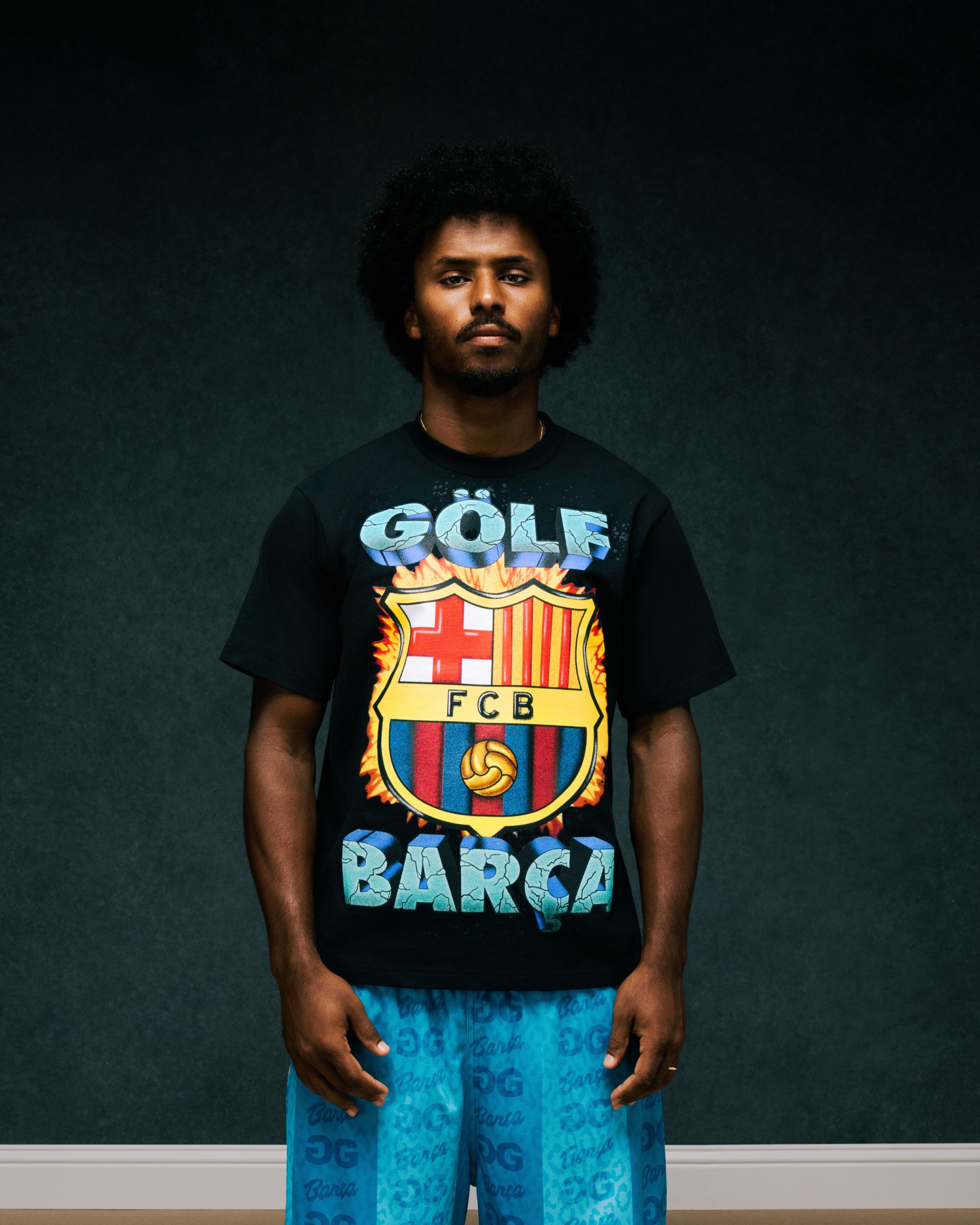 Person wearing clothing from the Nike x FC Barcelona x GOLF WANG (GOLF) collection.