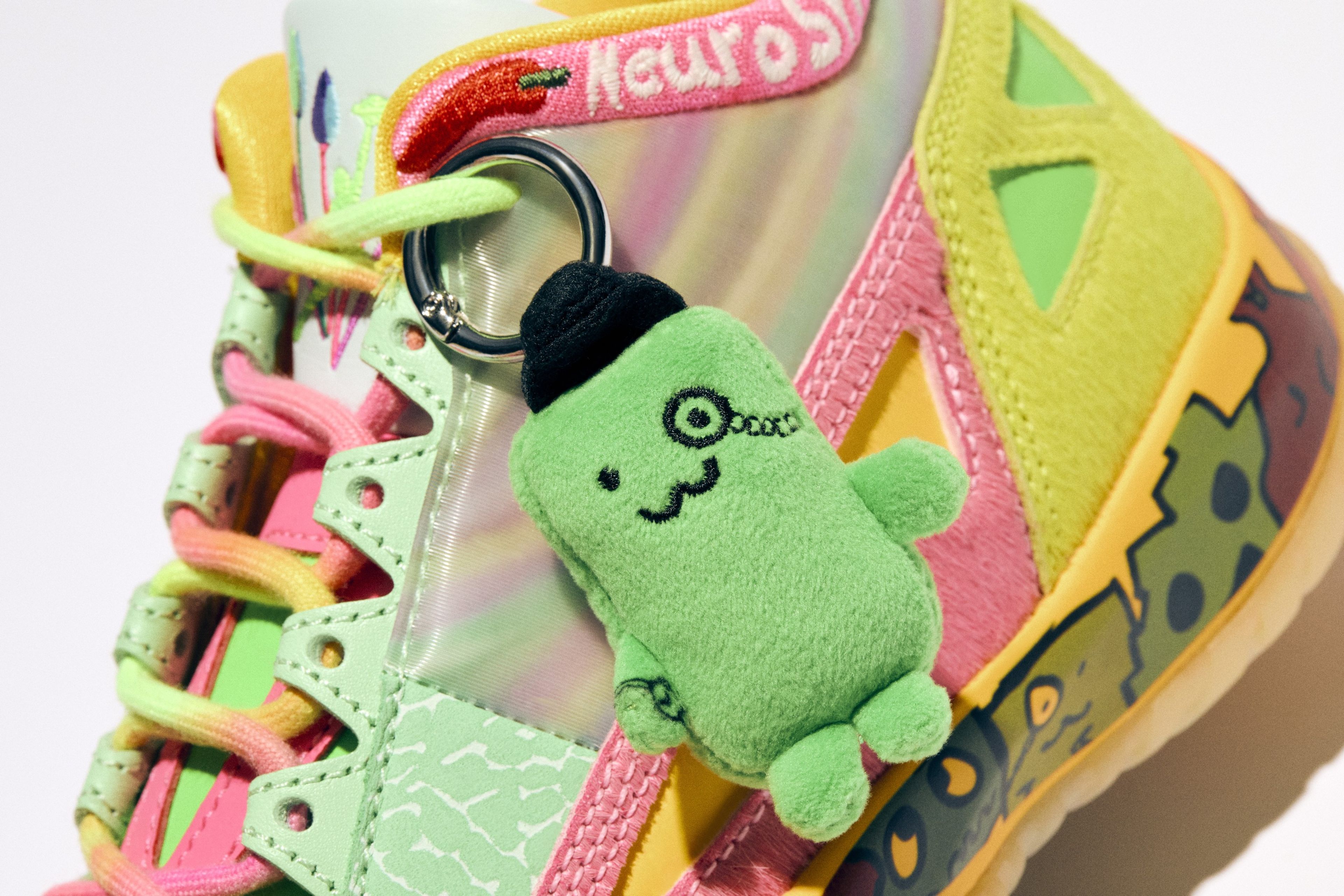 Air Jordan 11 Low IE A plushie hangtag and square dubrae.