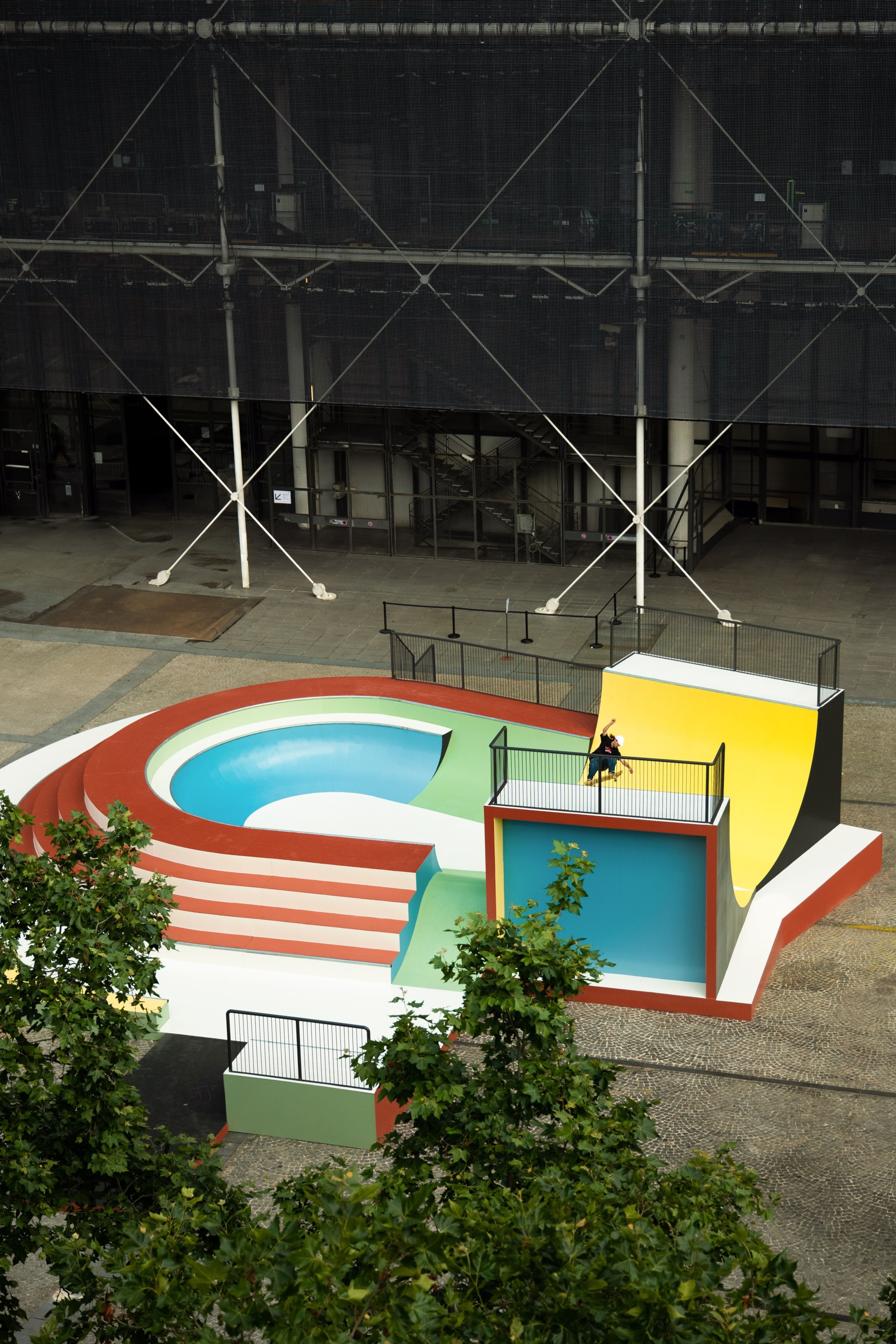 The Cycloid Piazza skate park, designed by Raphael Zarka, sits in front of the Nike Au Centre Pompidou in Paris, France.