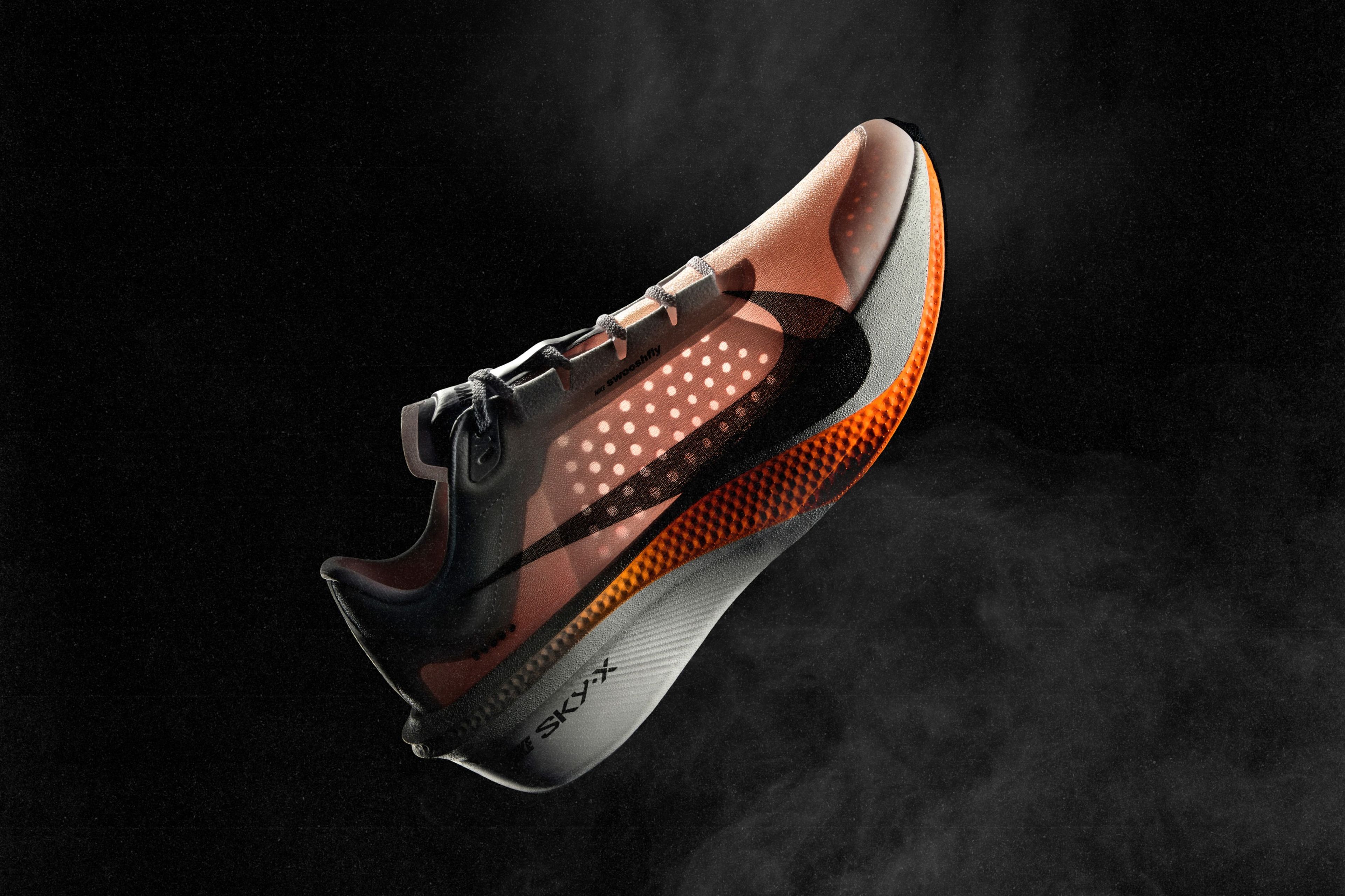 Nike Swooshfly running shoe with translucent upper and black Swoosh floating against a dark background.