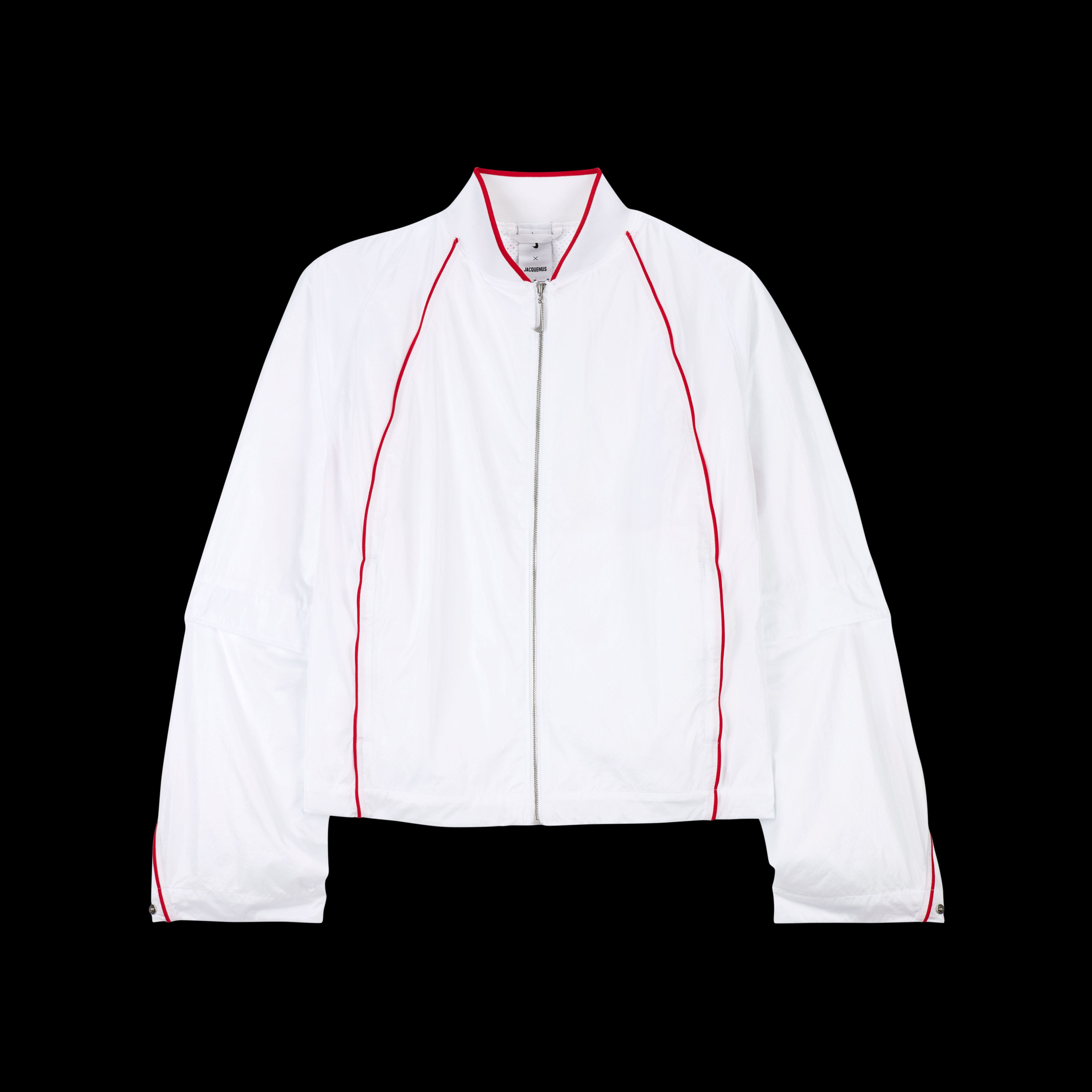 Overhead view of the Nike x Jacquemus Track Jacket in white with university red pinstripes at the neck, across the back and down the sleeve, and on the chest of the jacket. The jacket zipper pull is white in the shape of a Nike Swoosh. The piece floats on a black background.