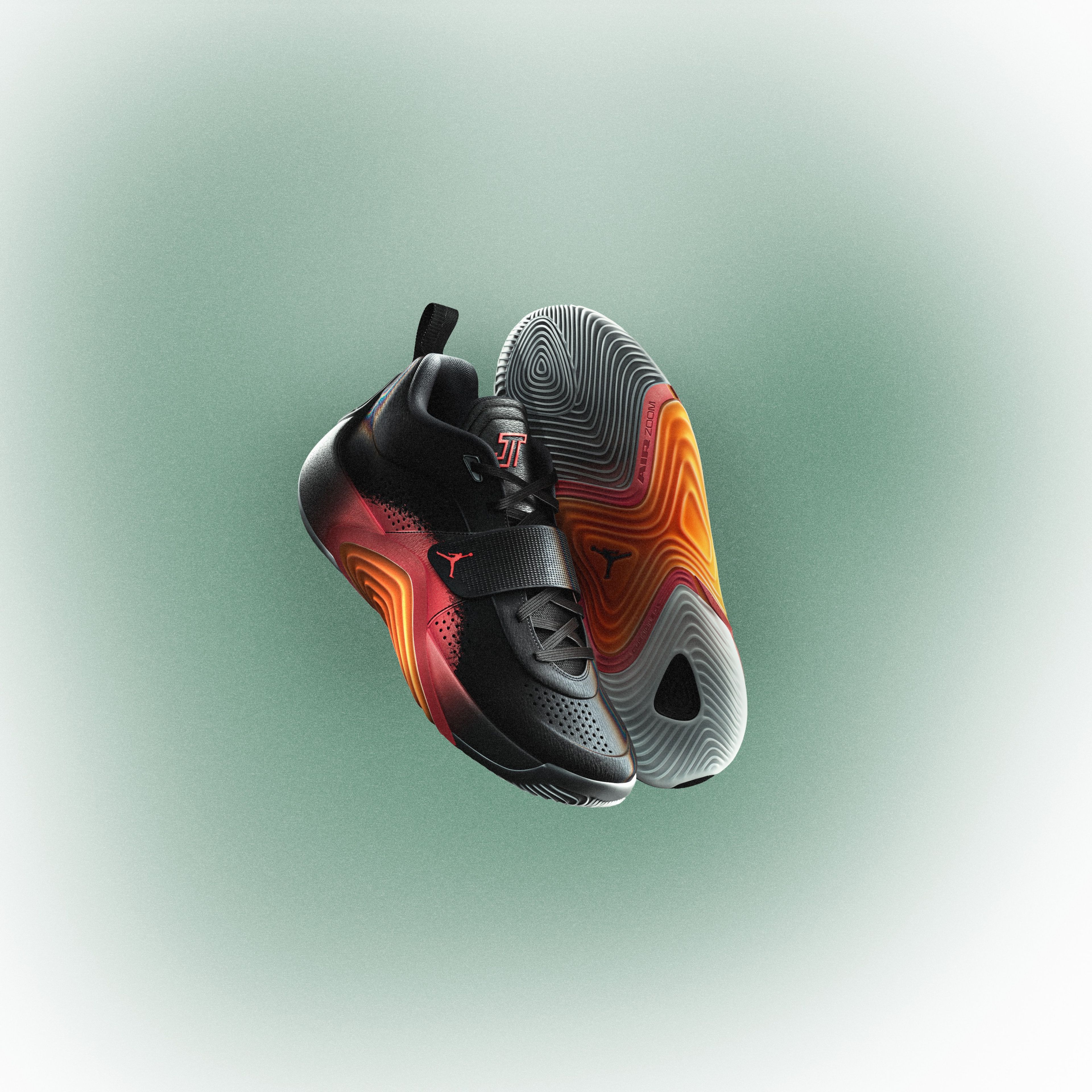 The Sunset colorway of the Jordan Brand Tatum 5 is pictured against a green and white background.
