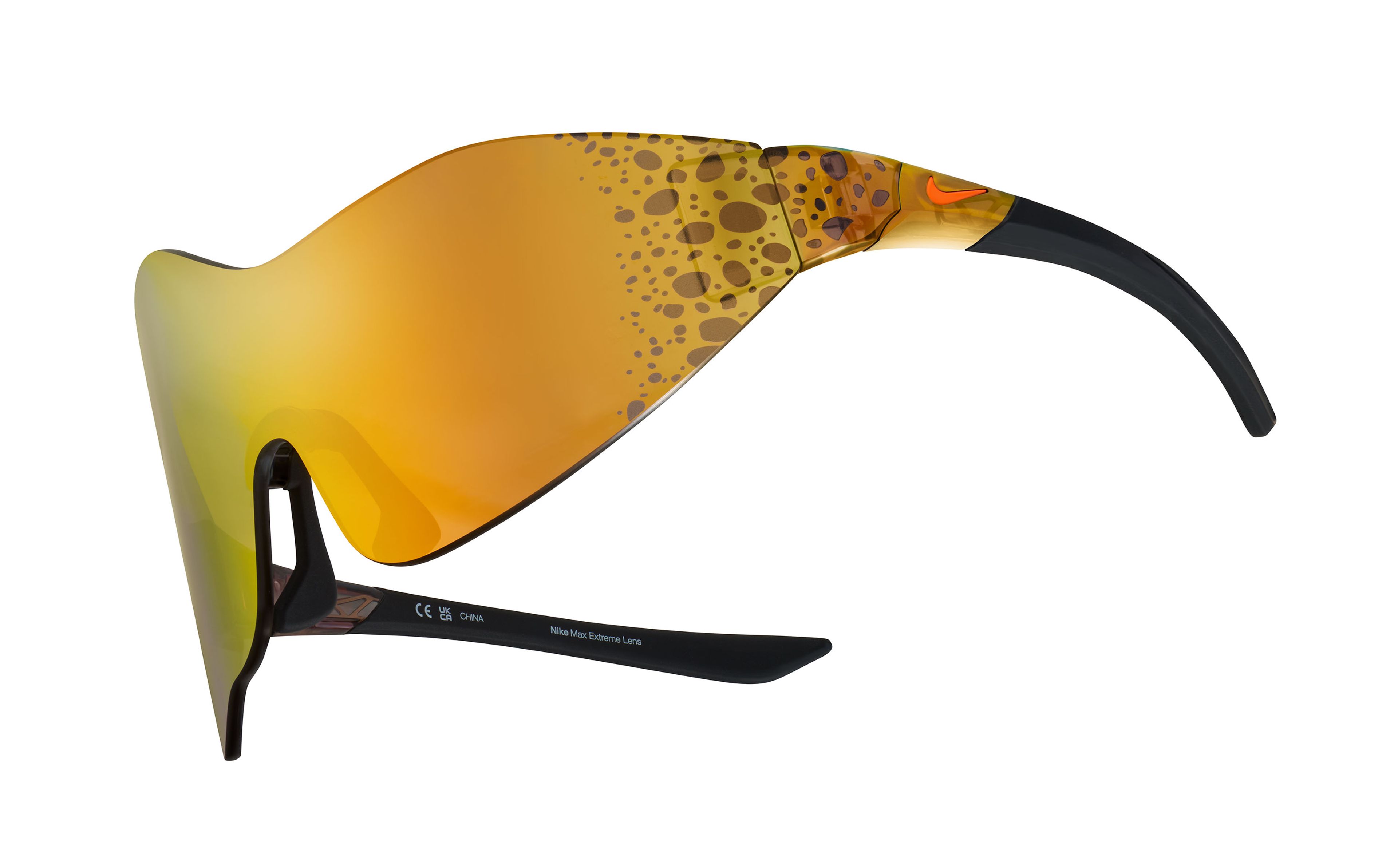 Front angled view of the Nike Athena sunglasses, showcasing the wrapping asymmetrical mirrored orange lens with Electric graphic at the temples. Electric graphic is a pattern of brown/black speckled spots. Glasses float on a white background.
