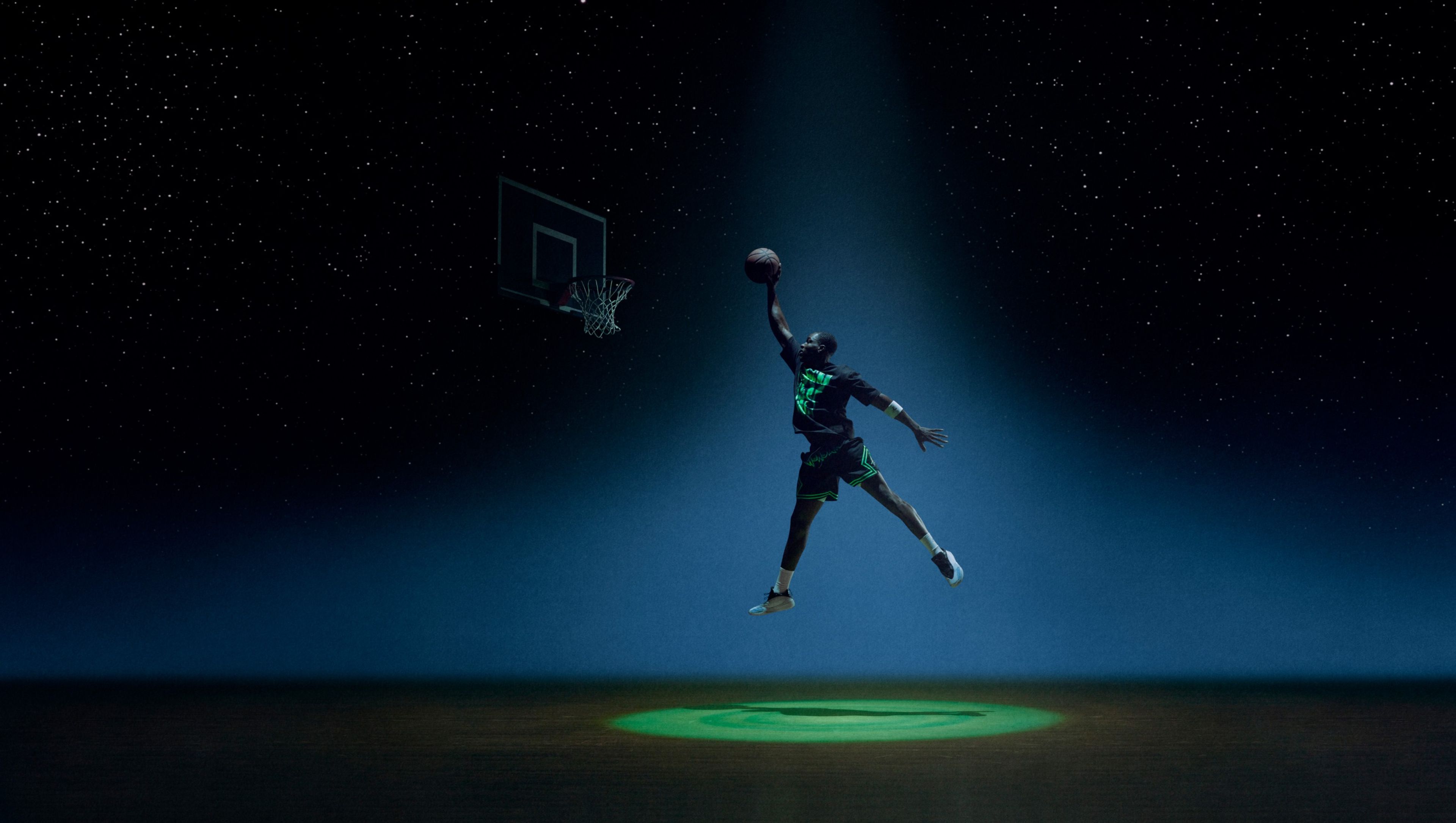 A basketball player wearing Jordan Brand x Space Jam Collection apparel.