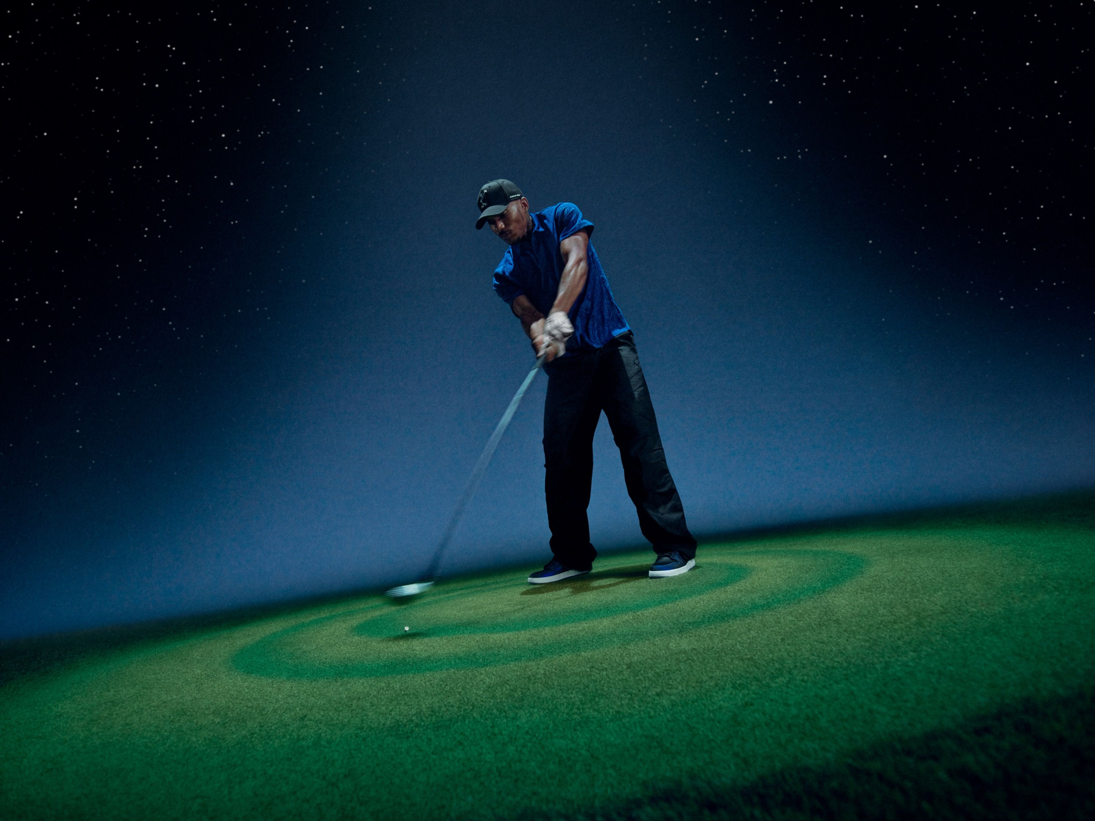 Golfer in Jordan Brand x Space Jam Collection apparel.