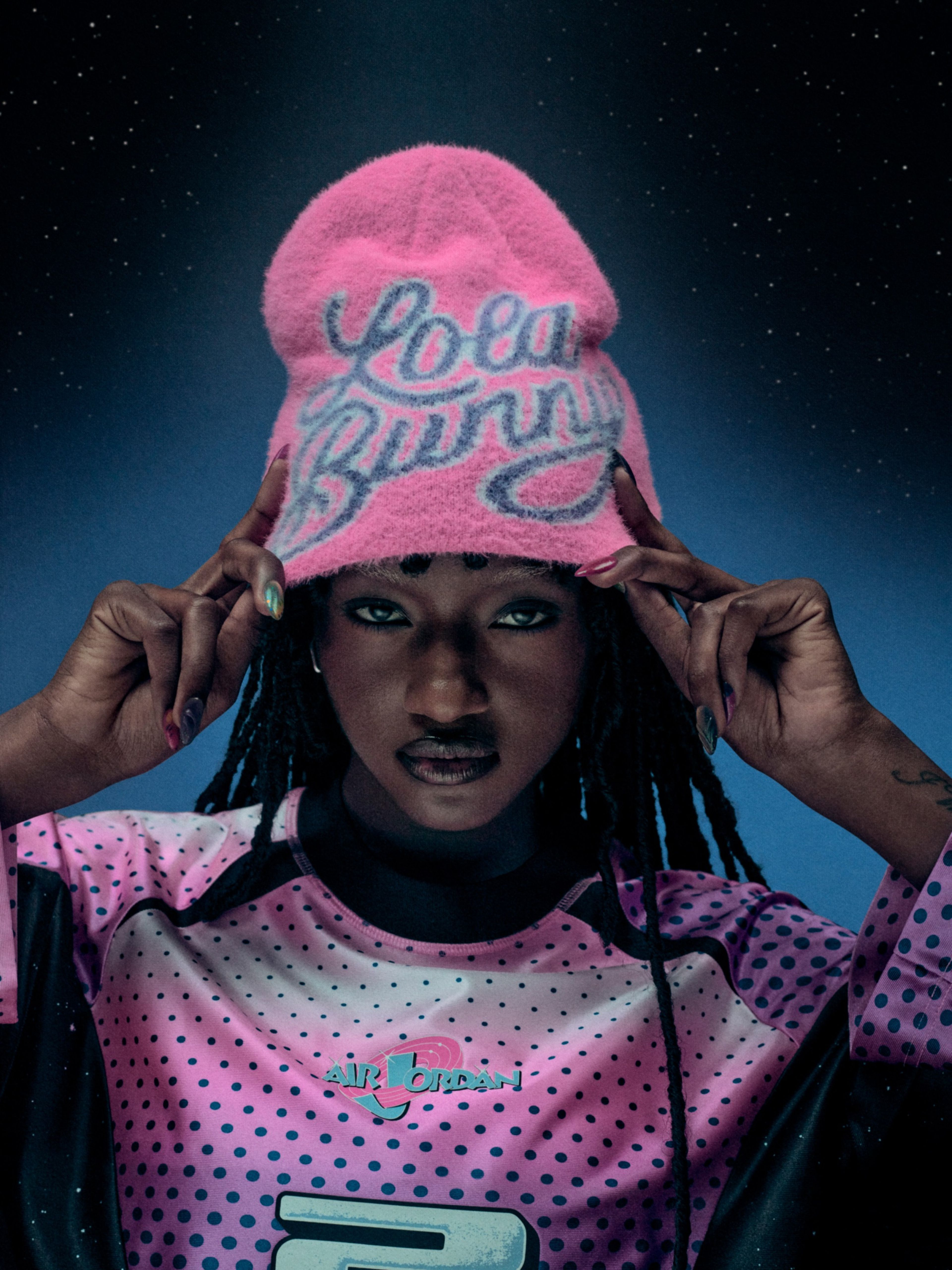 Person wearing a pink Lola Bunny hat with a long-sleeve jersey.
