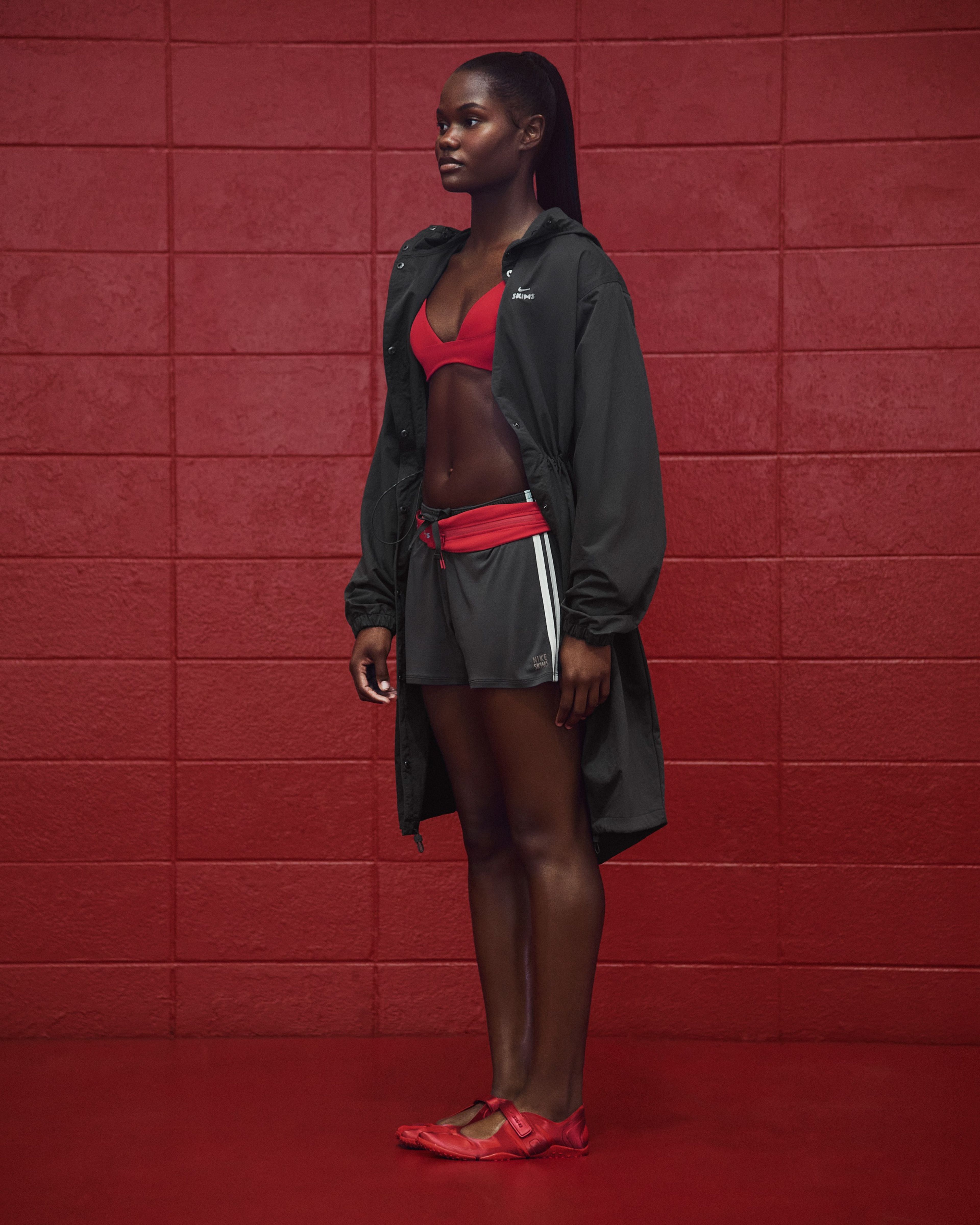 A University of Alabama cheerleader in NikeSKIMS apparel.
