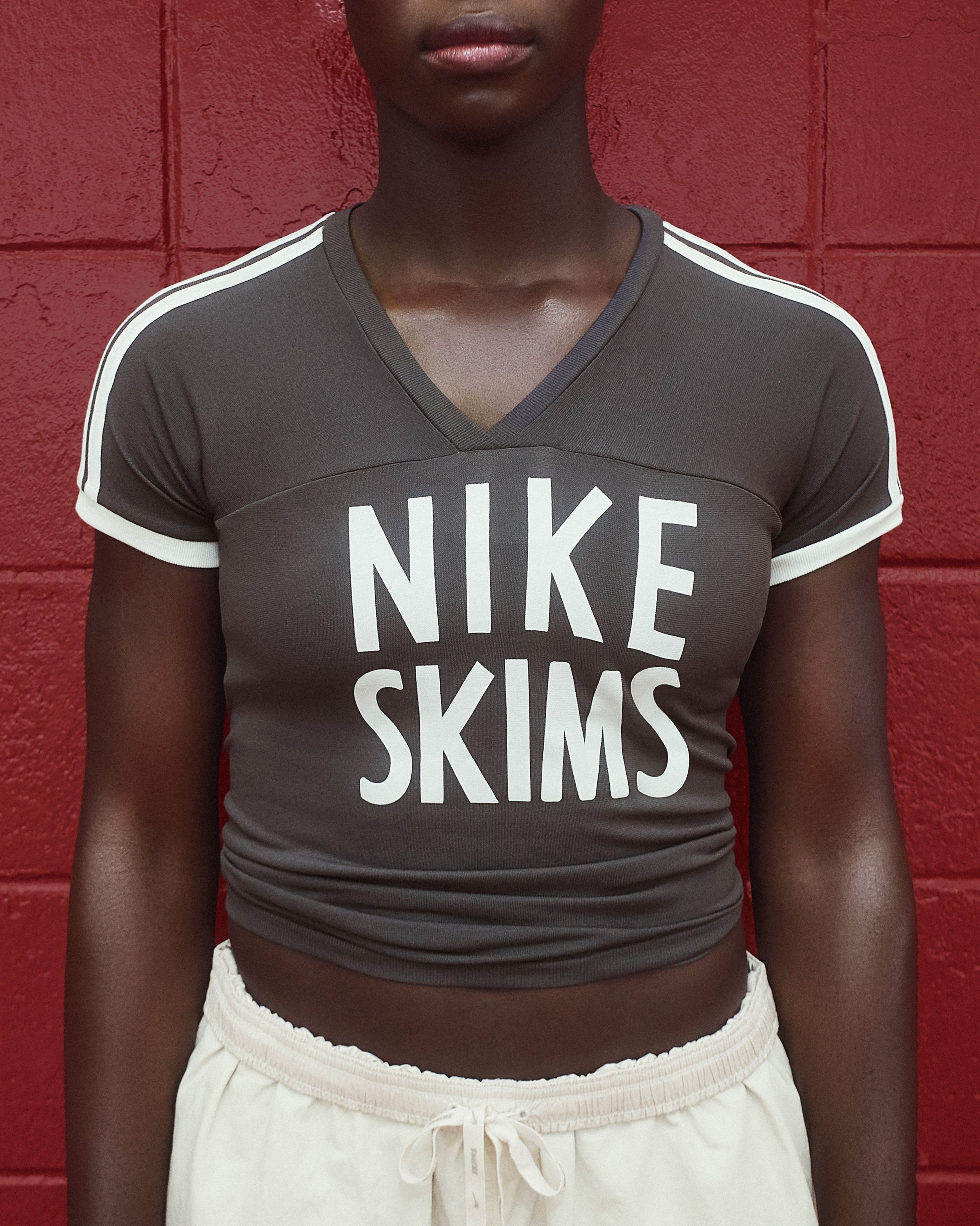 A University of Alabama cheerleader in NikeSKIMS apparel.