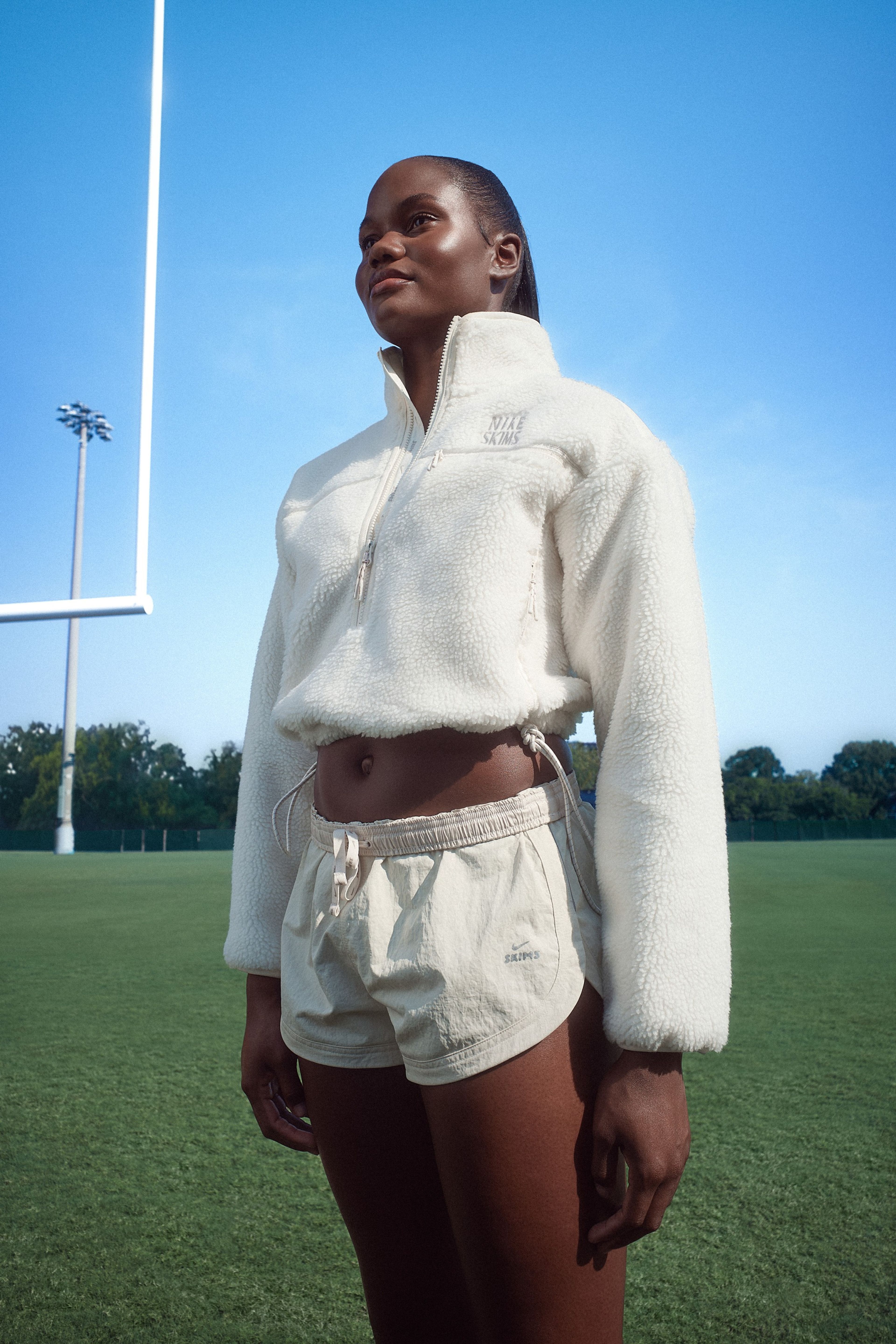 A University of Alabama cheerleader in NikeSKIMS apparel.