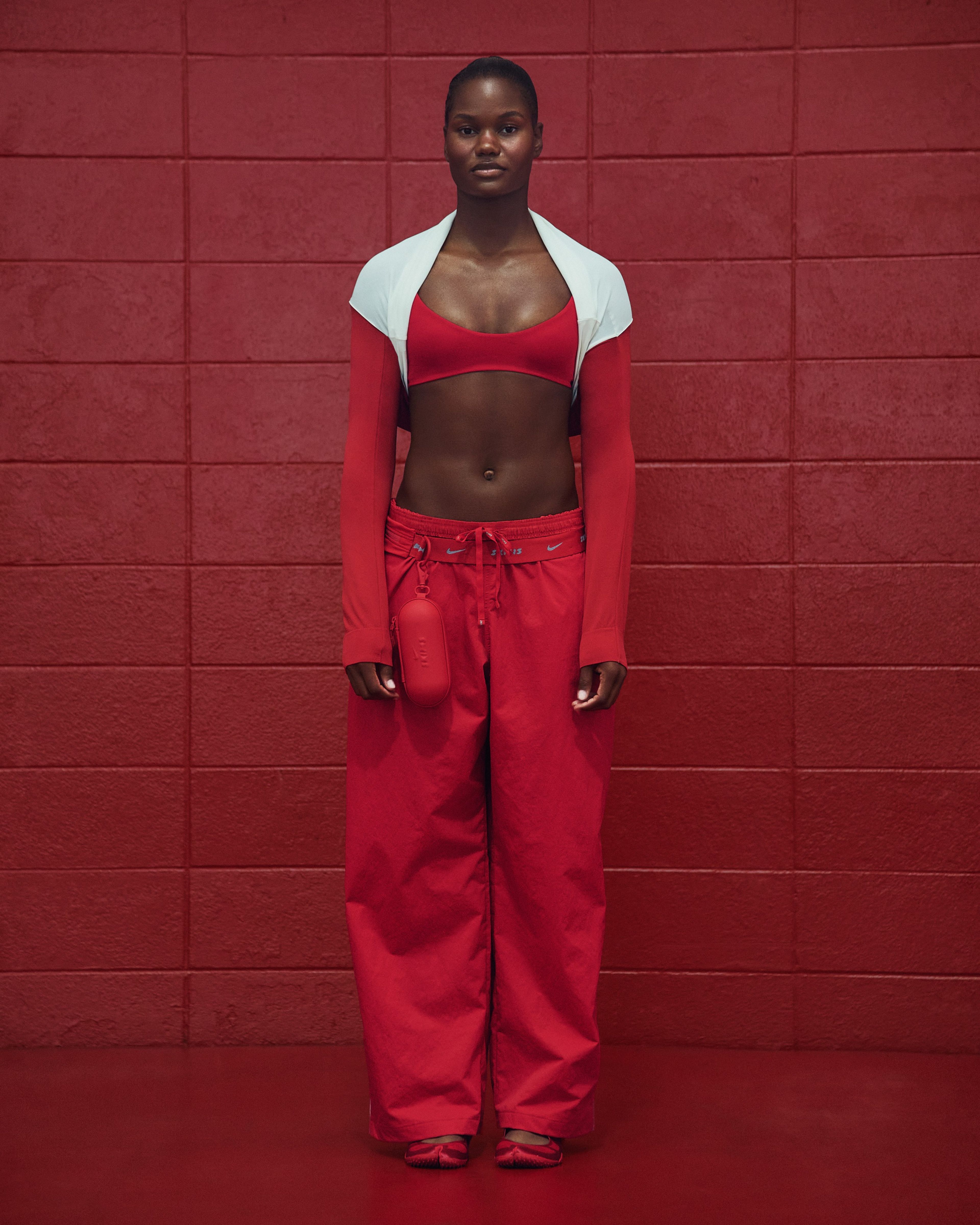 A University of Alabama cheerleader in NikeSKIMS apparel.