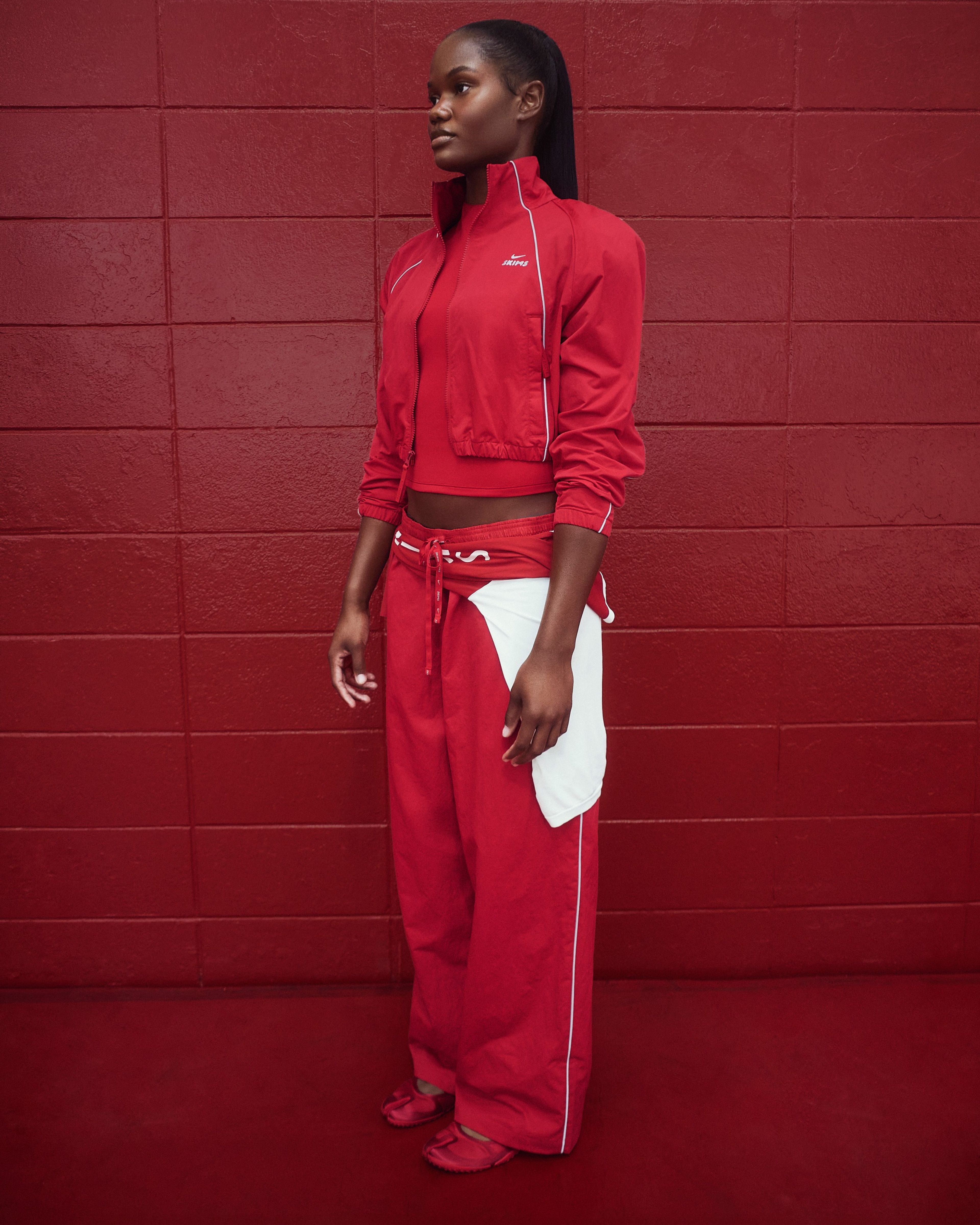 A University of Alabama cheerleader in NikeSKIMS apparel.