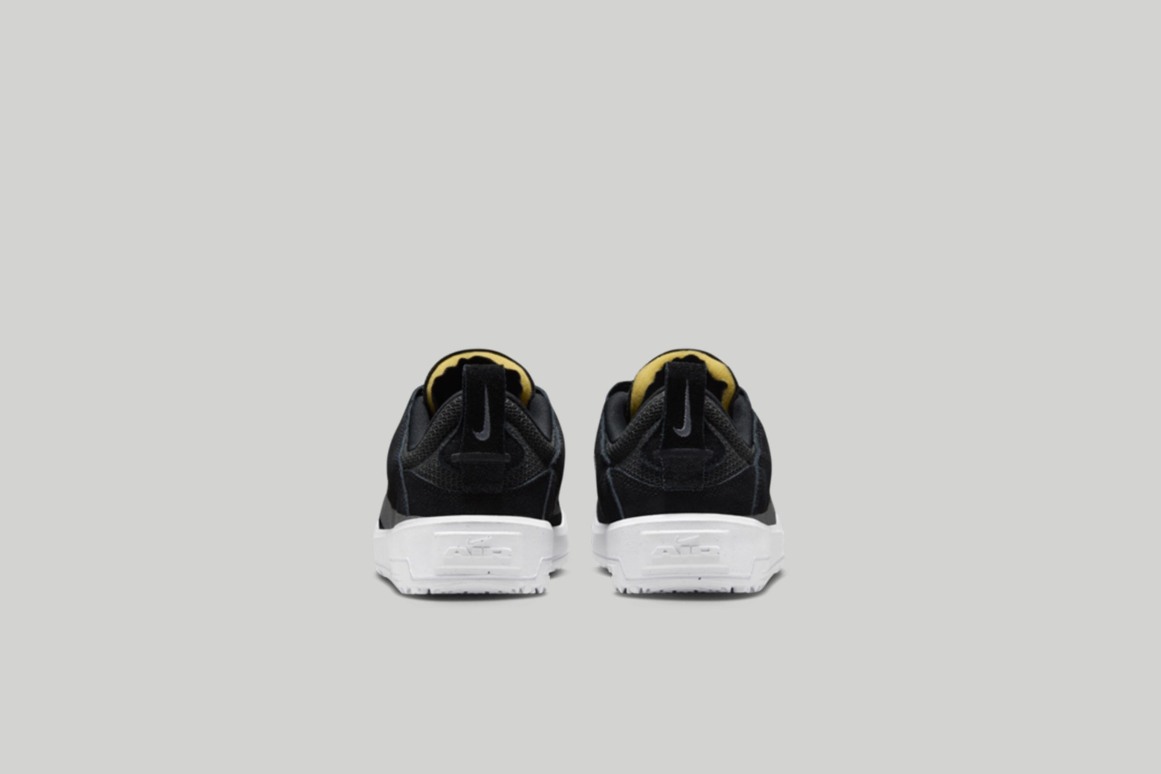 Back view of the kids Nike SB Day One in black.