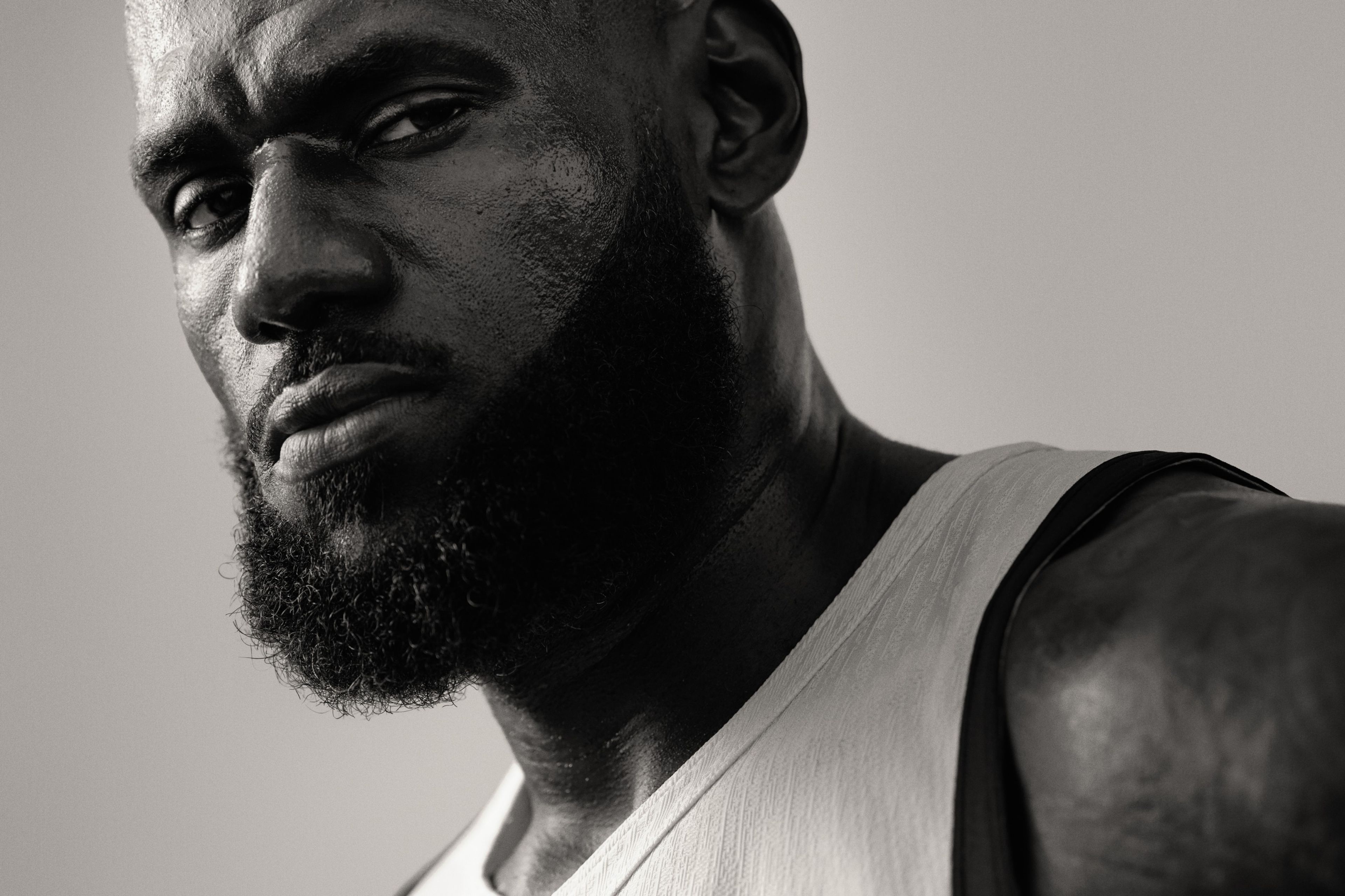 Black and white close up of Lebron James looking directly at the camera.