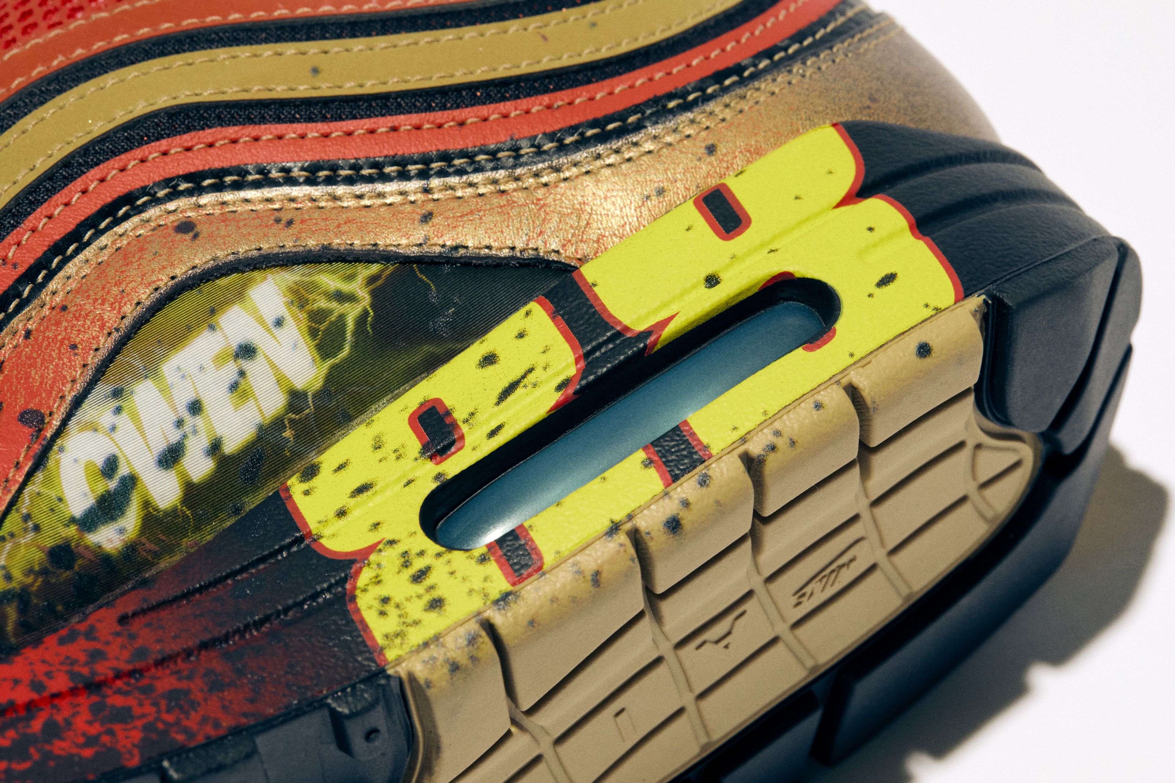 Close-up of an Nike Air Max 97 with lenticular graphics on the medial added to look like sequential panels in a superhero comic book.