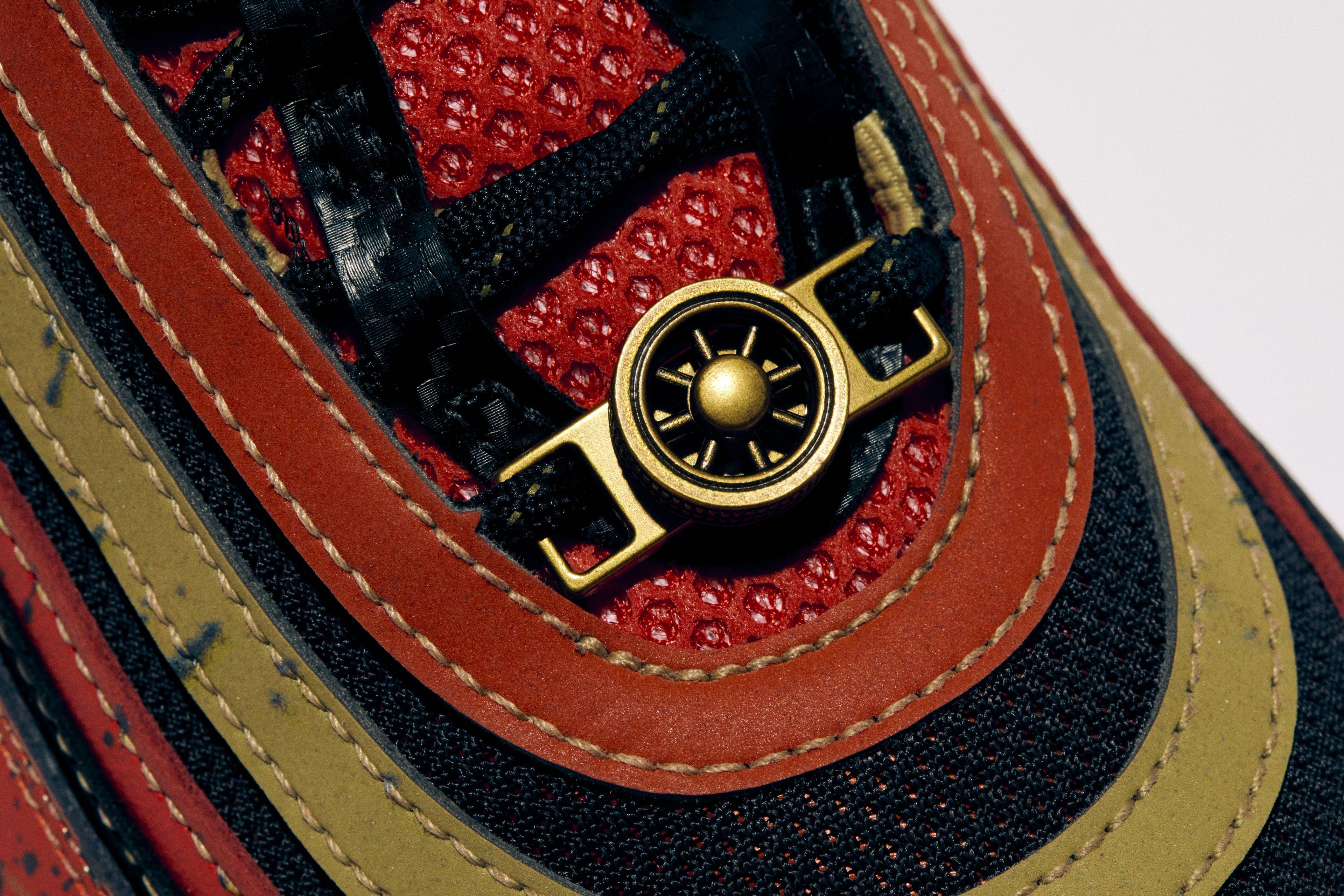Close-up of a Nike sneaker tongue featuring a spinning wheel dubrae.