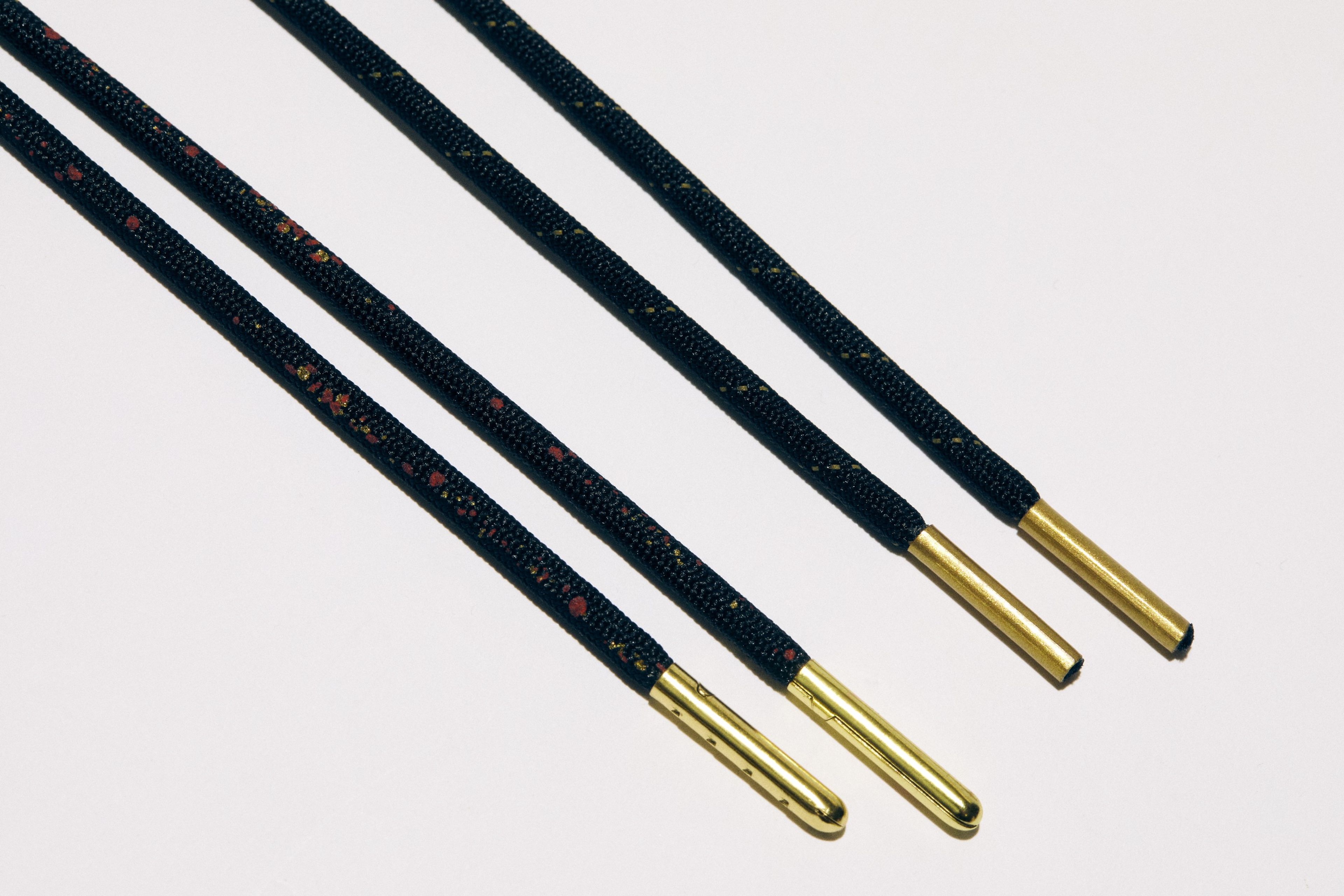 Accented black and gold laces