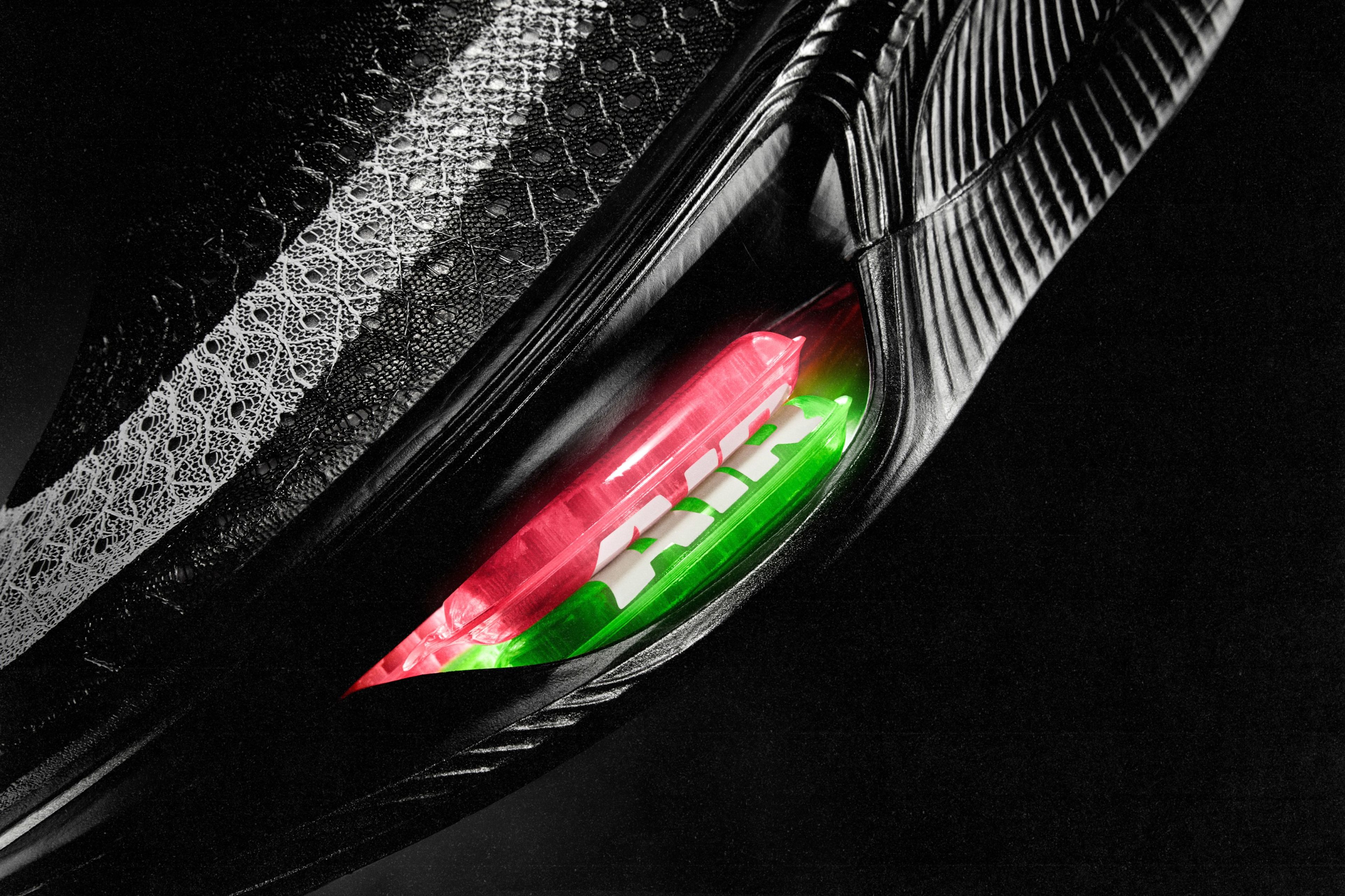 The Nike Apex racing shoe with a visible, double-stacked red and green Air Zoom unit in the forefoot.