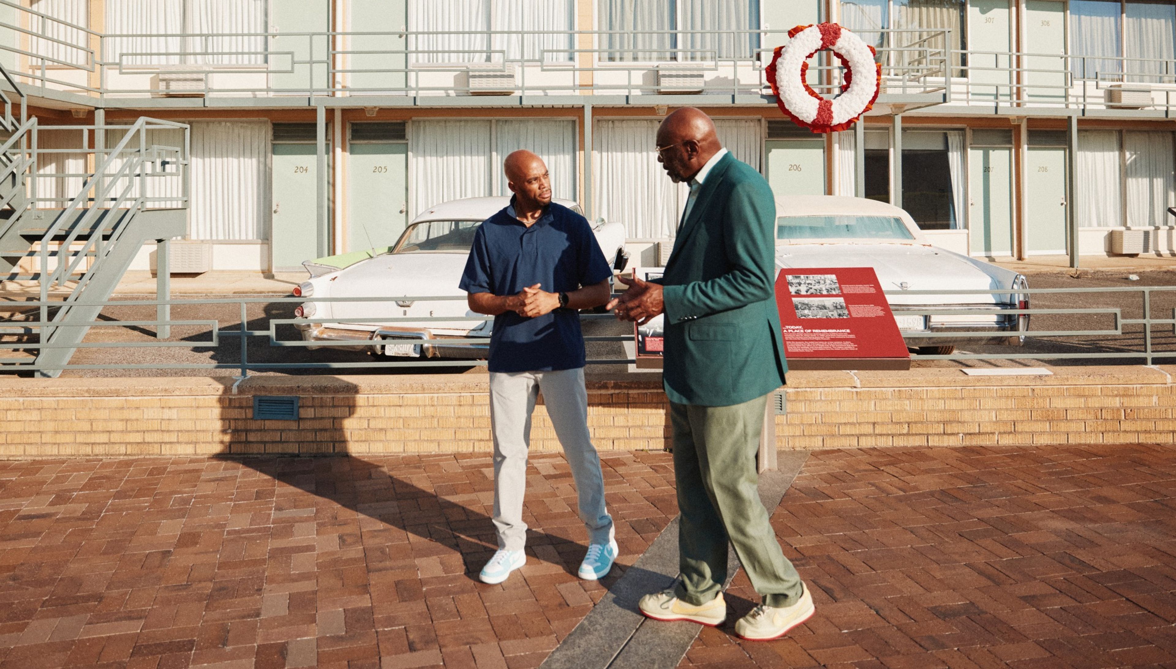 Coley Harvey and Willie Gregory walk outside the National Civil Rights Museum in Memphis.