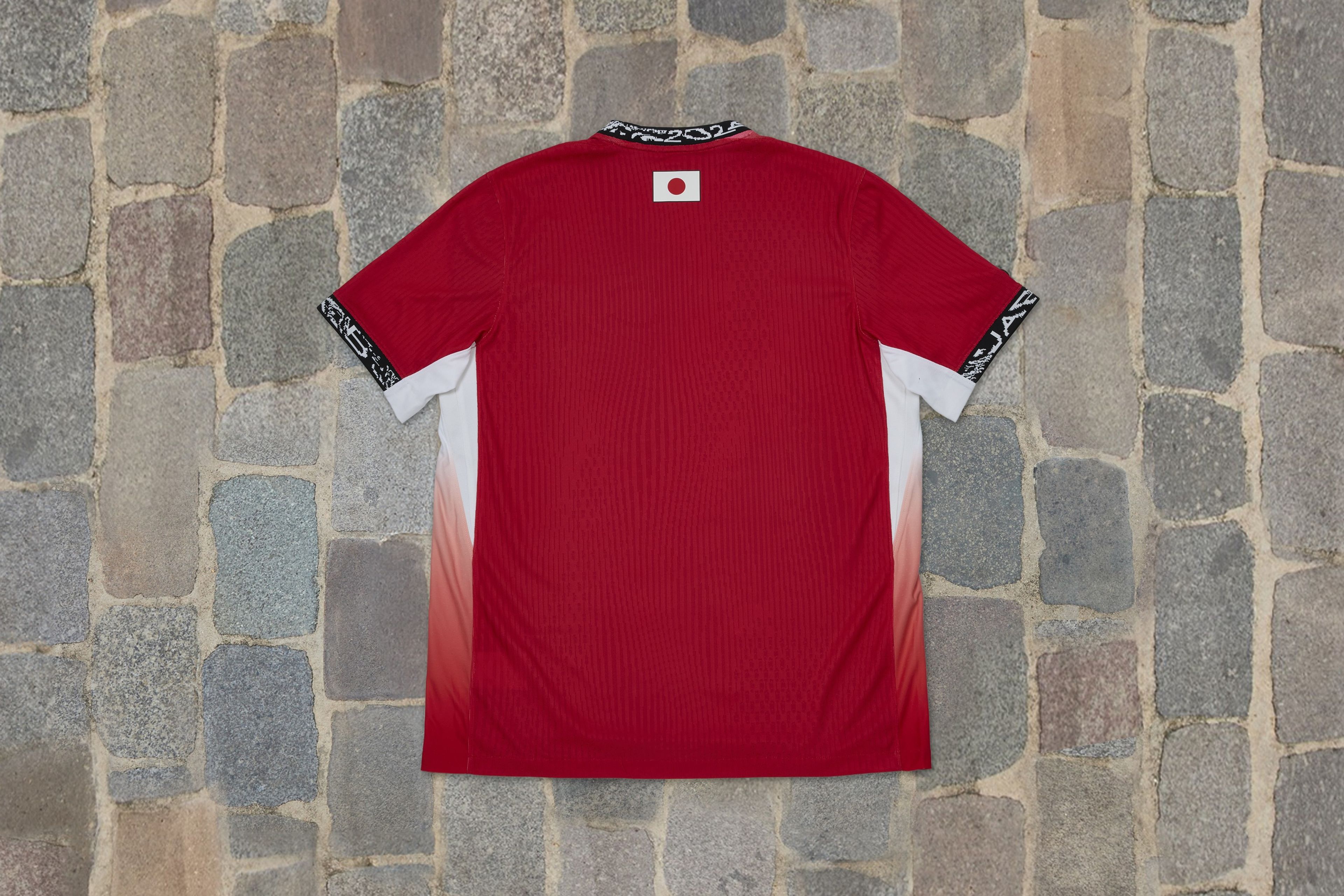 Overhead view of a shirt in cherry blossom colors from the Japan skateboarding federation kit