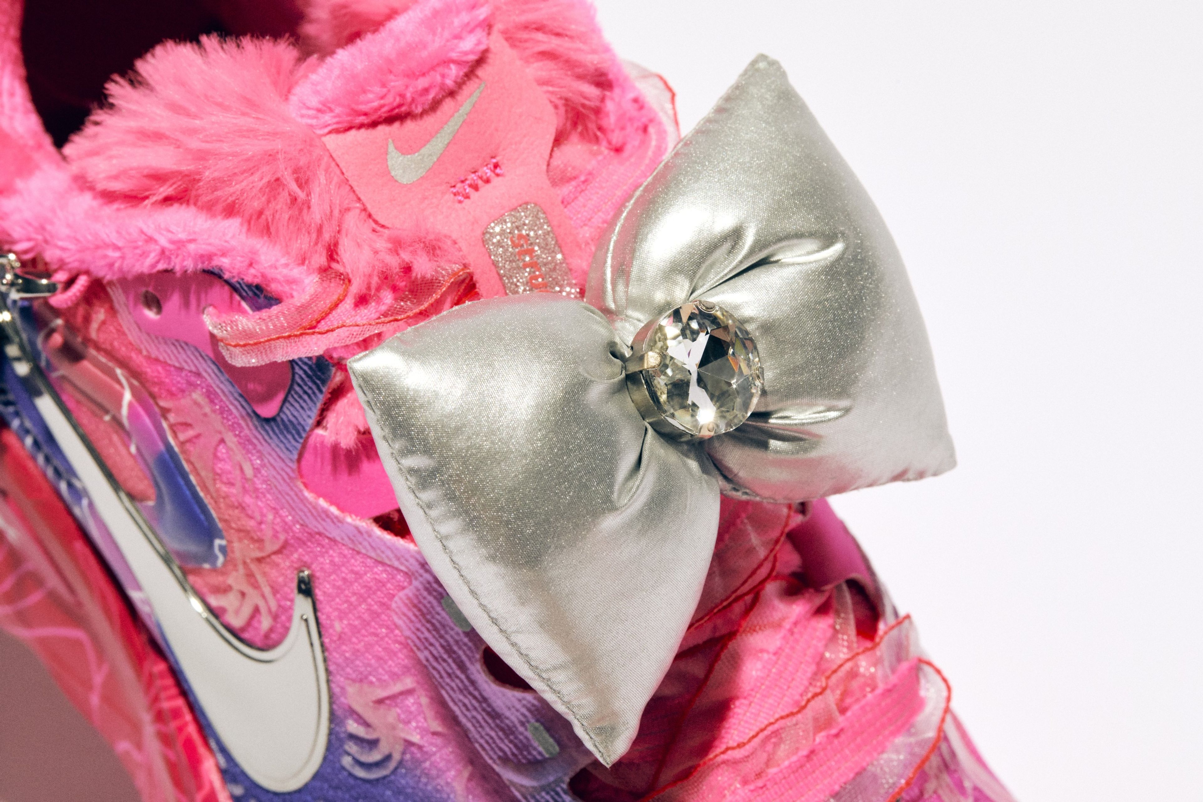 A hair clip accessory hugs a pair of Nike Structure Plus.