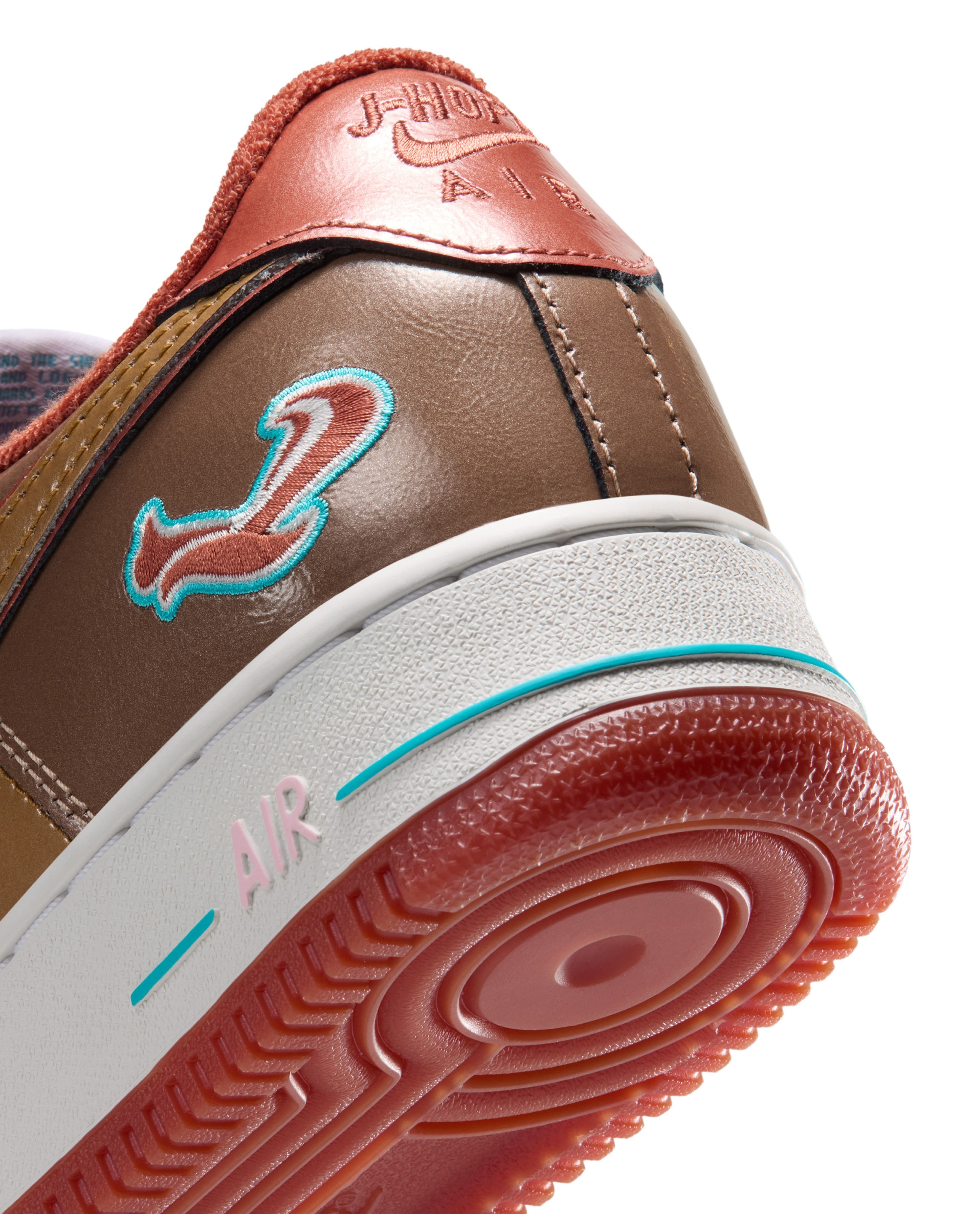 Nigo and j-hope’s reimagined Nike Air Force 1 features a glossy Burnt Sunrise and Metallic Gold leather upper, Chlorine Blue accents and signature squirrel graphics.
