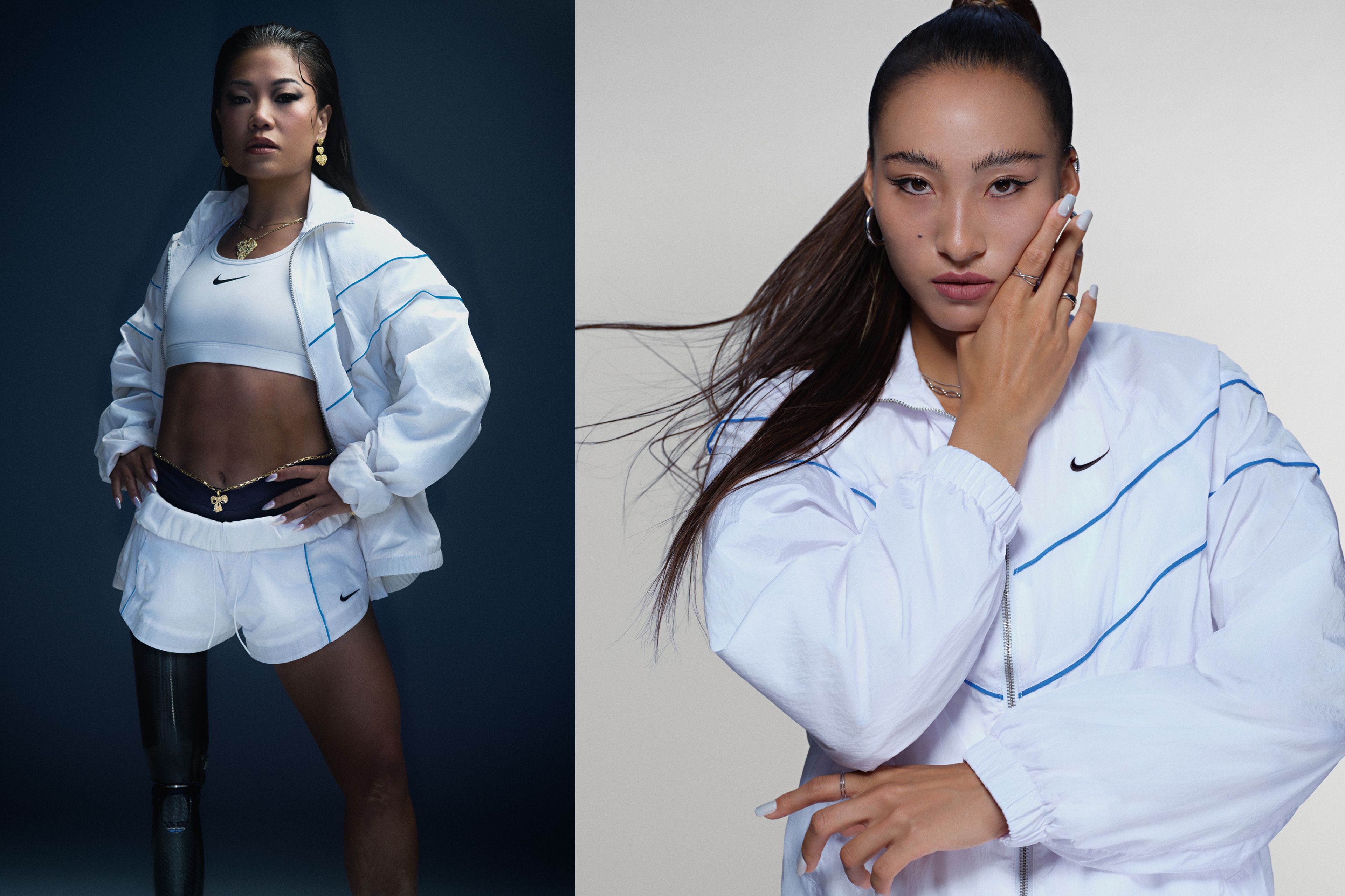 Two photos sit side by side. Scout Bassett is imaged on the left where she stands on her prosthetic leg, wearing a white Nike Windrunner tracksuit jacket and Woven Shorts, along with a white Nike Swoosh Sports Bra. Scout wears a variety of gold jewelry with her tracksuit attire, against a dark blue background. On the right, we see the top half of Ana Zheng's body. She is wearing a white Nike Windrunner tracksuit jacket and stands against a white background. Ana raises her hand to her face, displaying her white painted nails and silver rings.